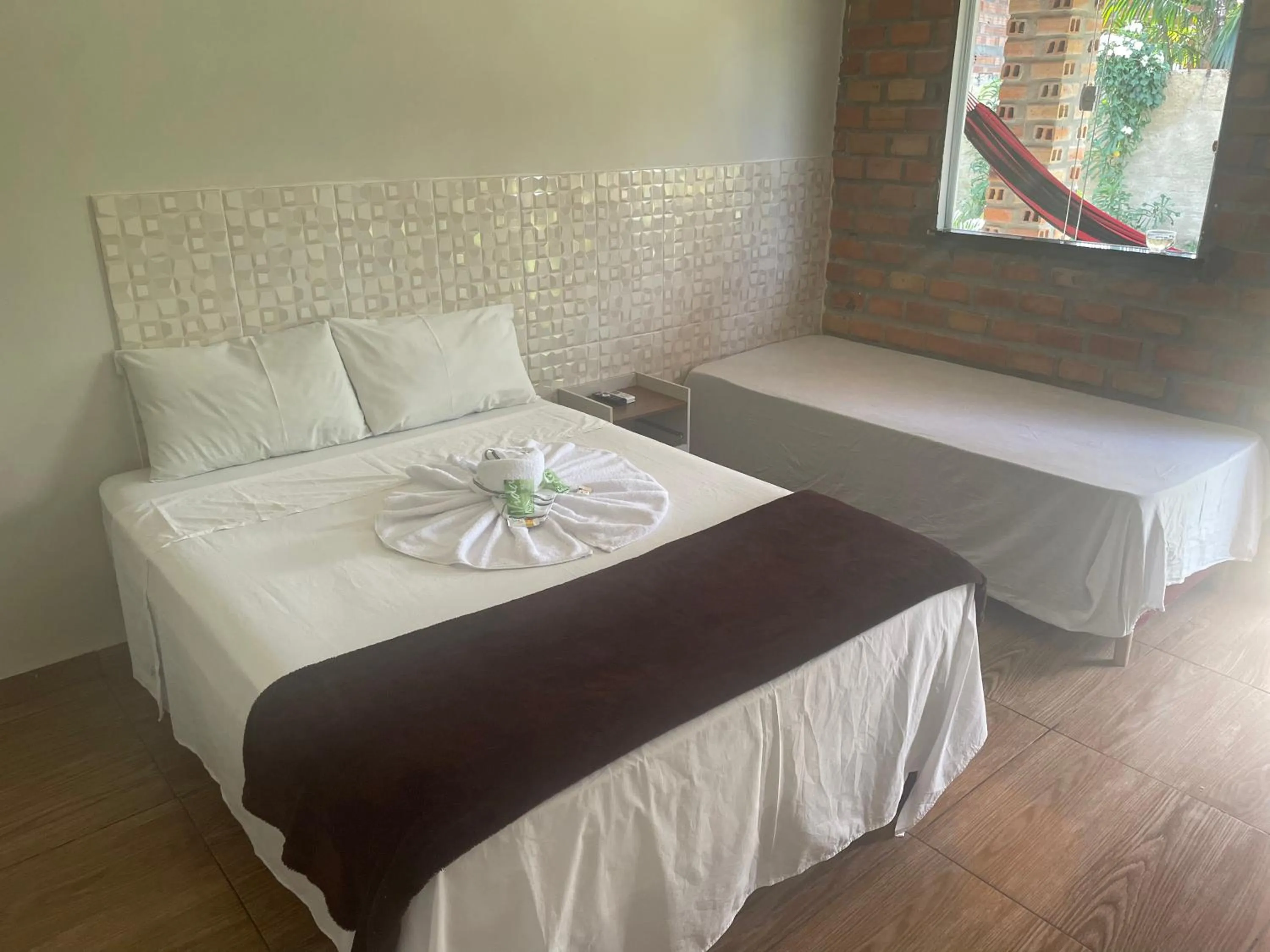 Bed in Pousada RIOSTOUR