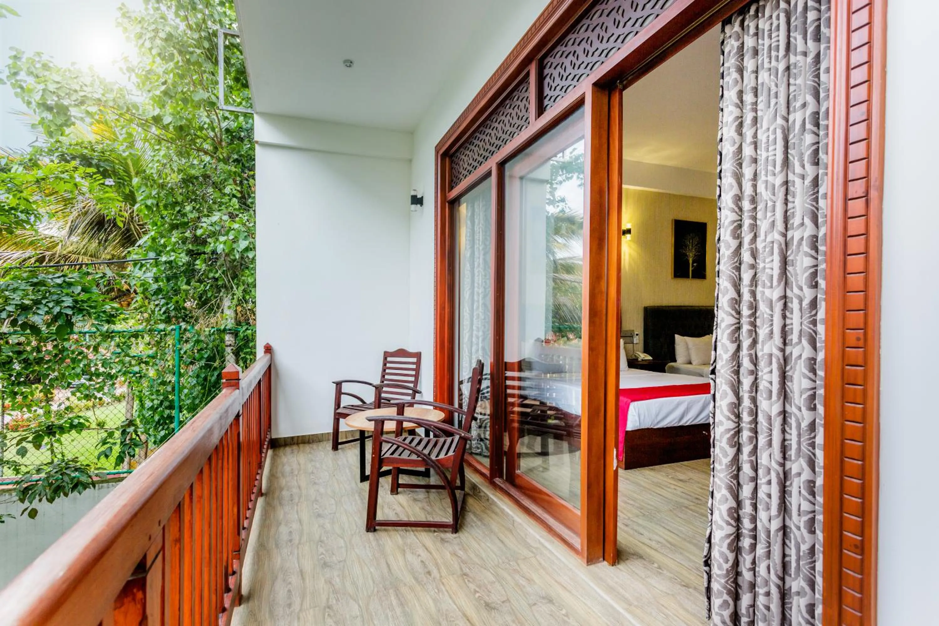 Balcony/Terrace, Bed in Polhena Grand Resort & Banquet