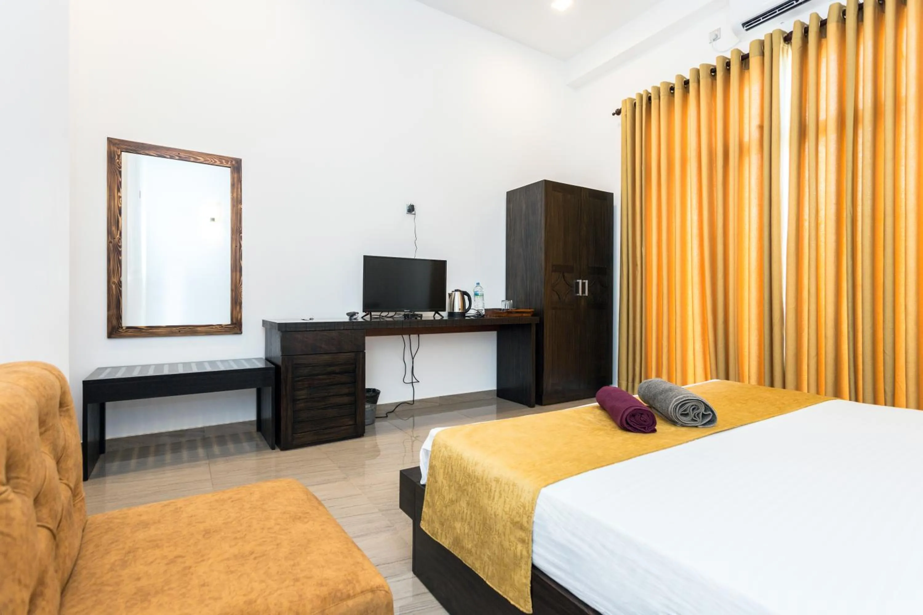 Bed in Polhena Grand Resort & Banquet