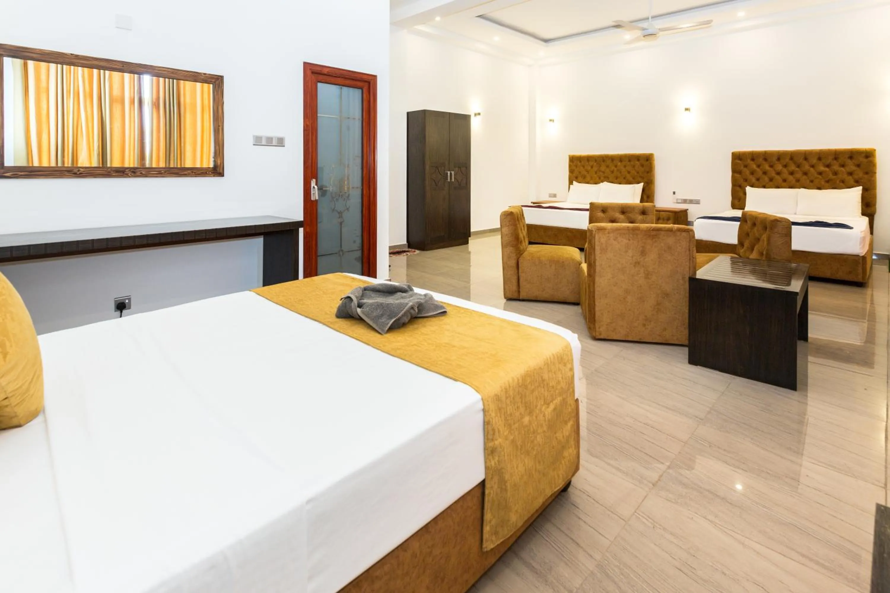 Bed in Polhena Grand Resort & Banquet