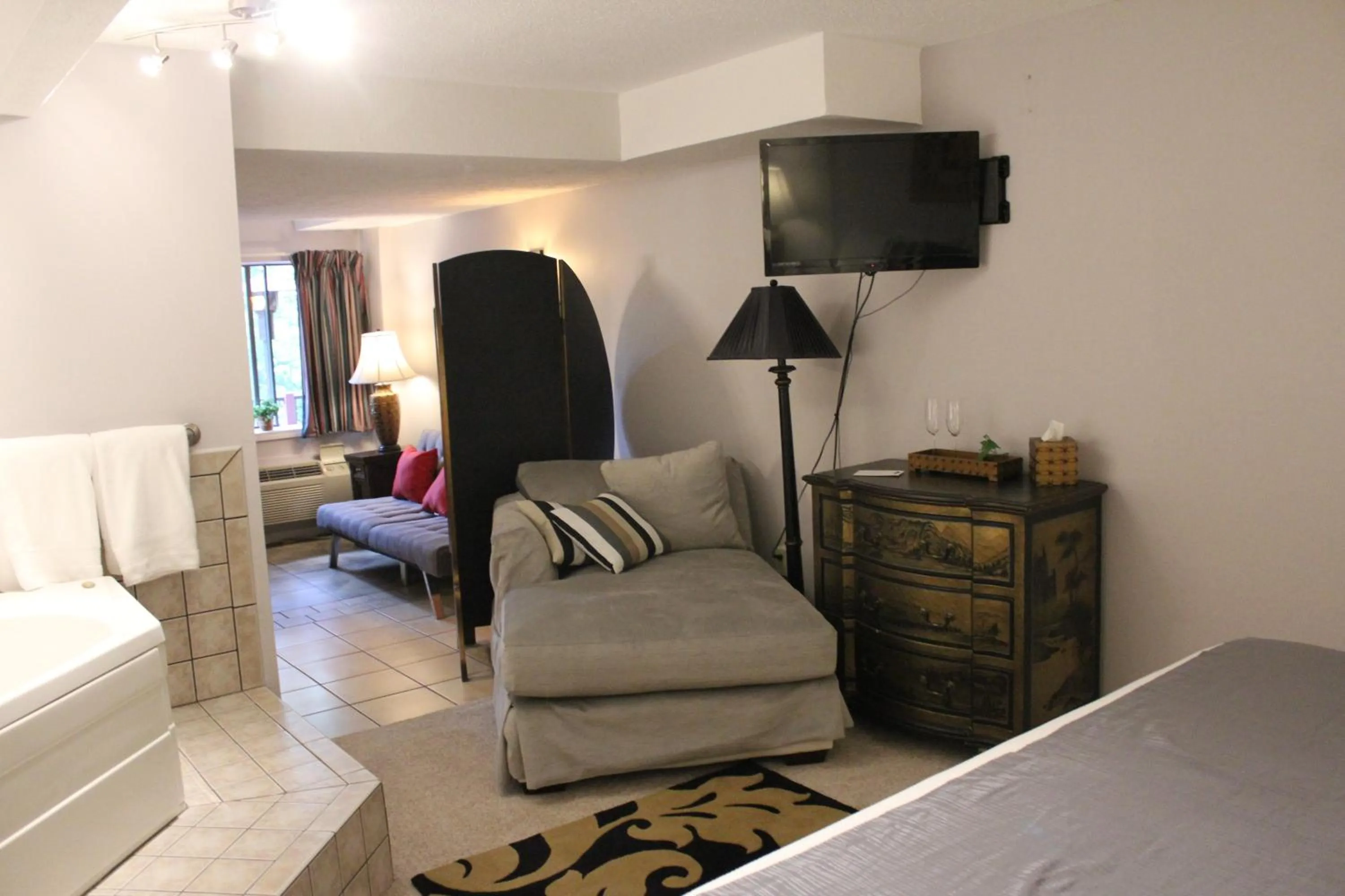 Bed in Brydan Suites