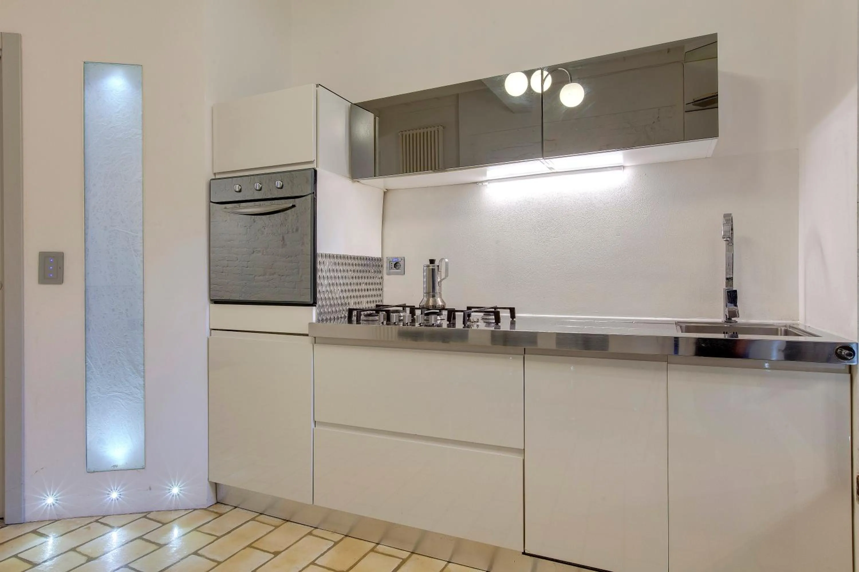 Kitchen or kitchenette in Victor Apartment by Mamo Florence