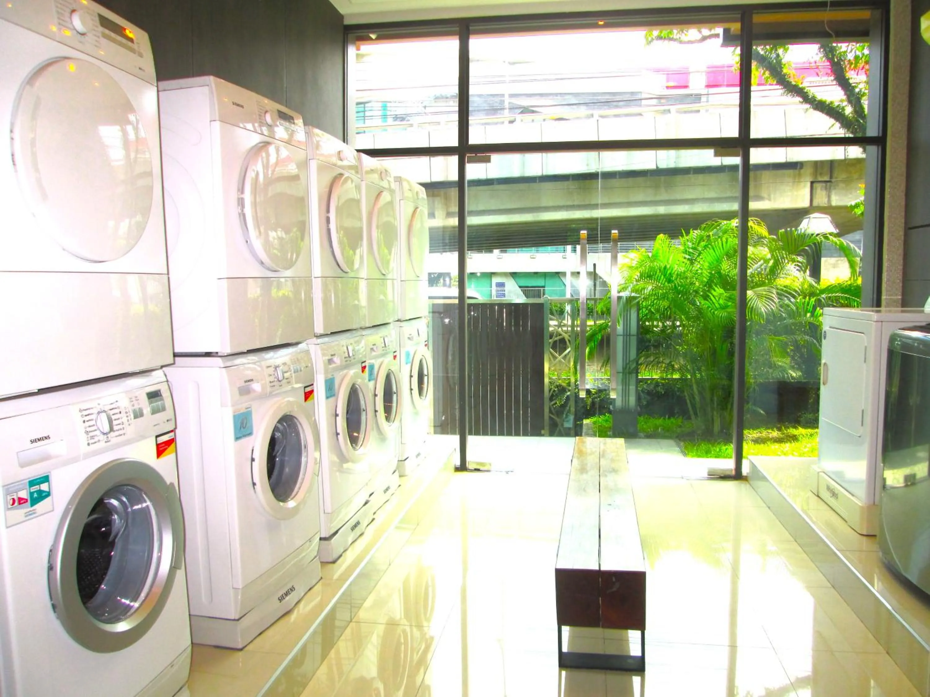 washing machine in Nest n Rest Hotel