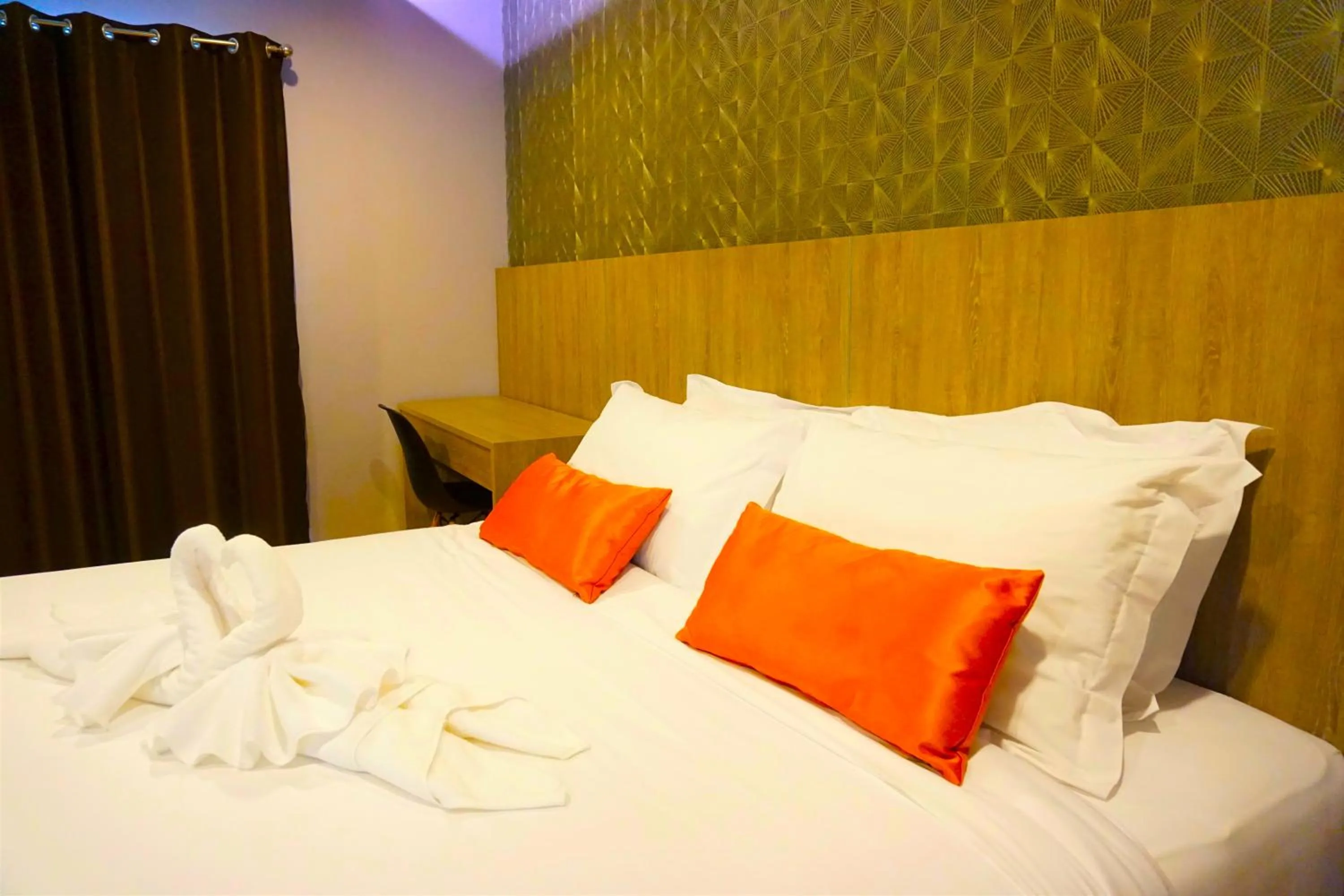 Bed in Nest n Rest Hotel