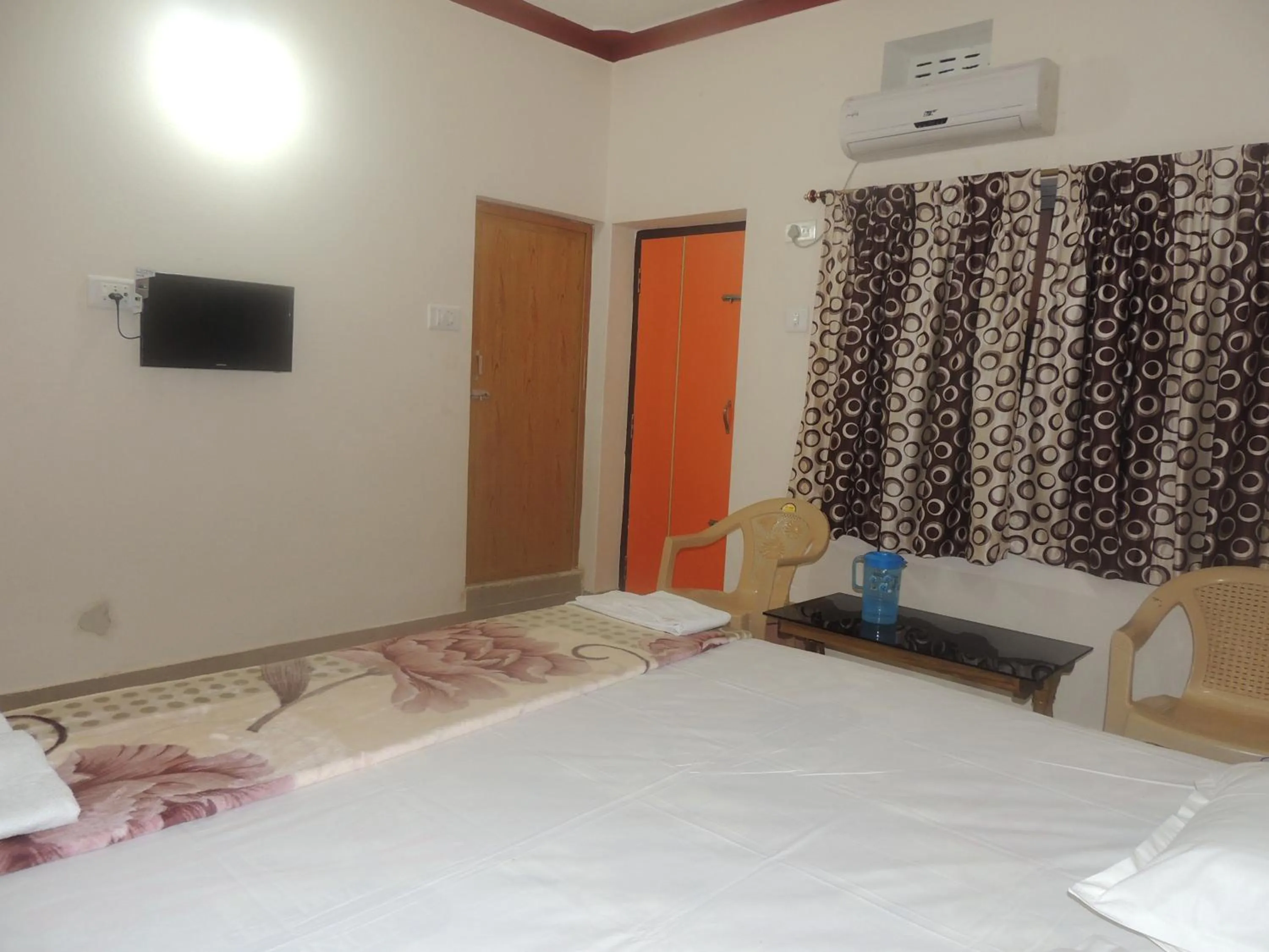 Photo of the whole room, Bed in Surya Inn