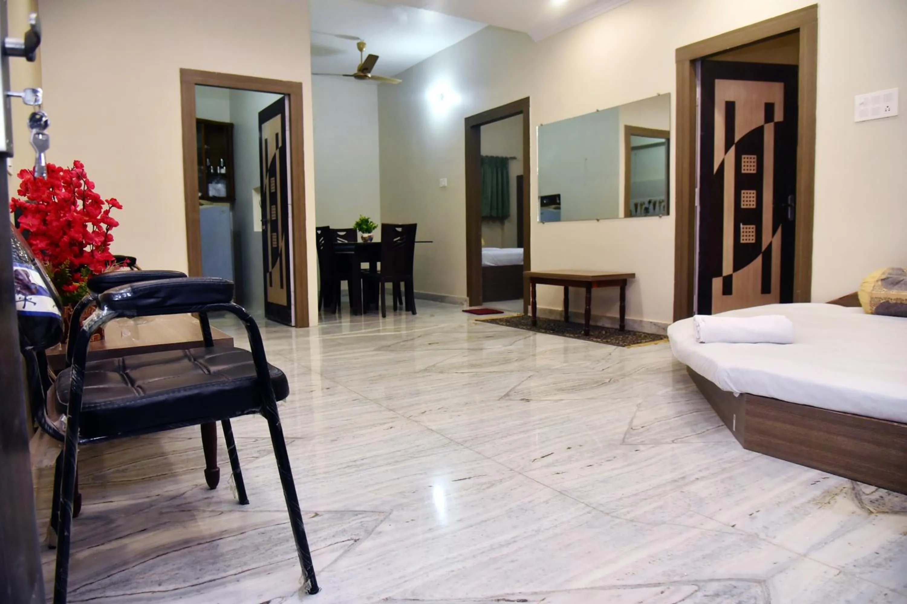 Seating area, Bed in Bluebells Varanasi