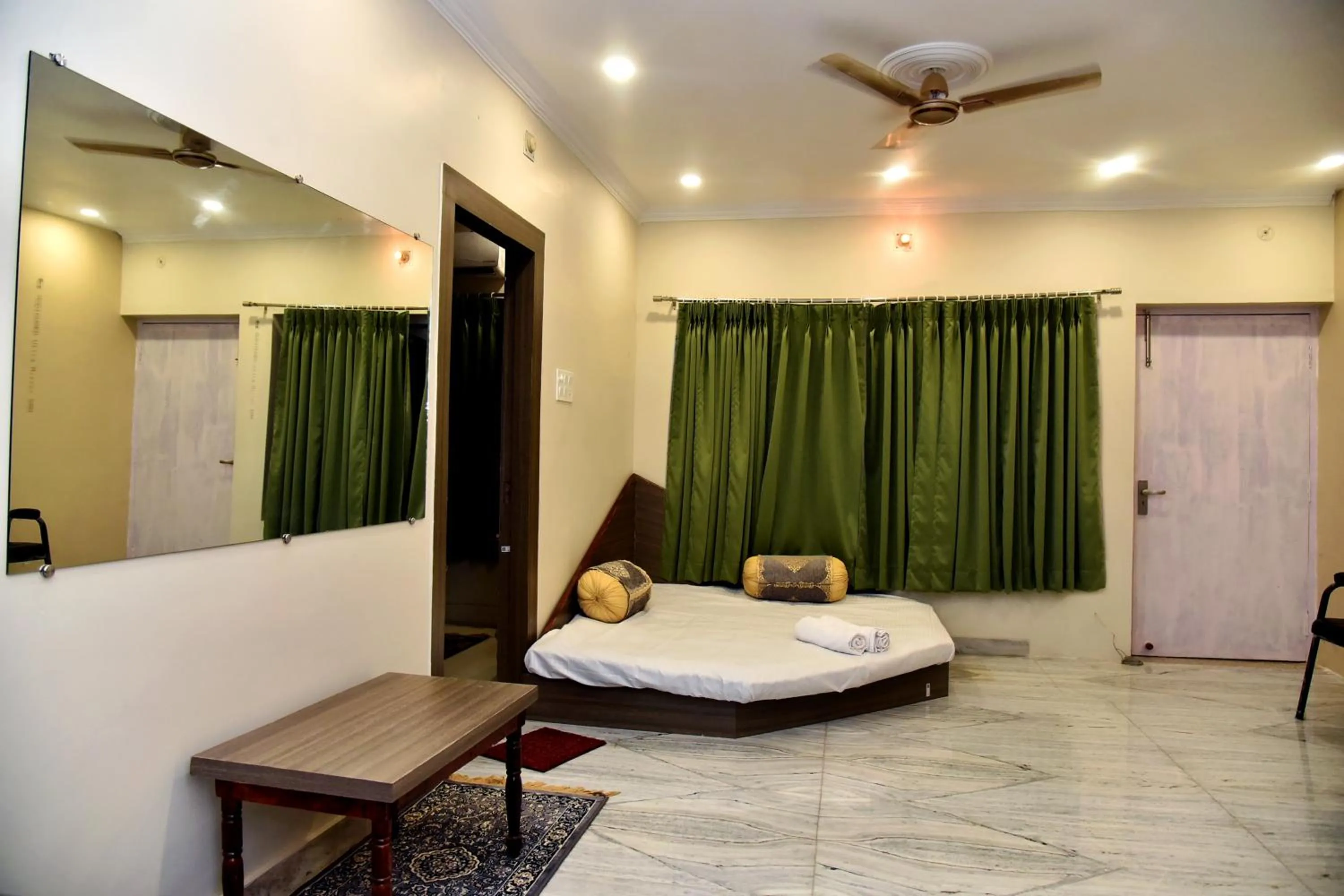 Seating area, Bed in Bluebells Varanasi