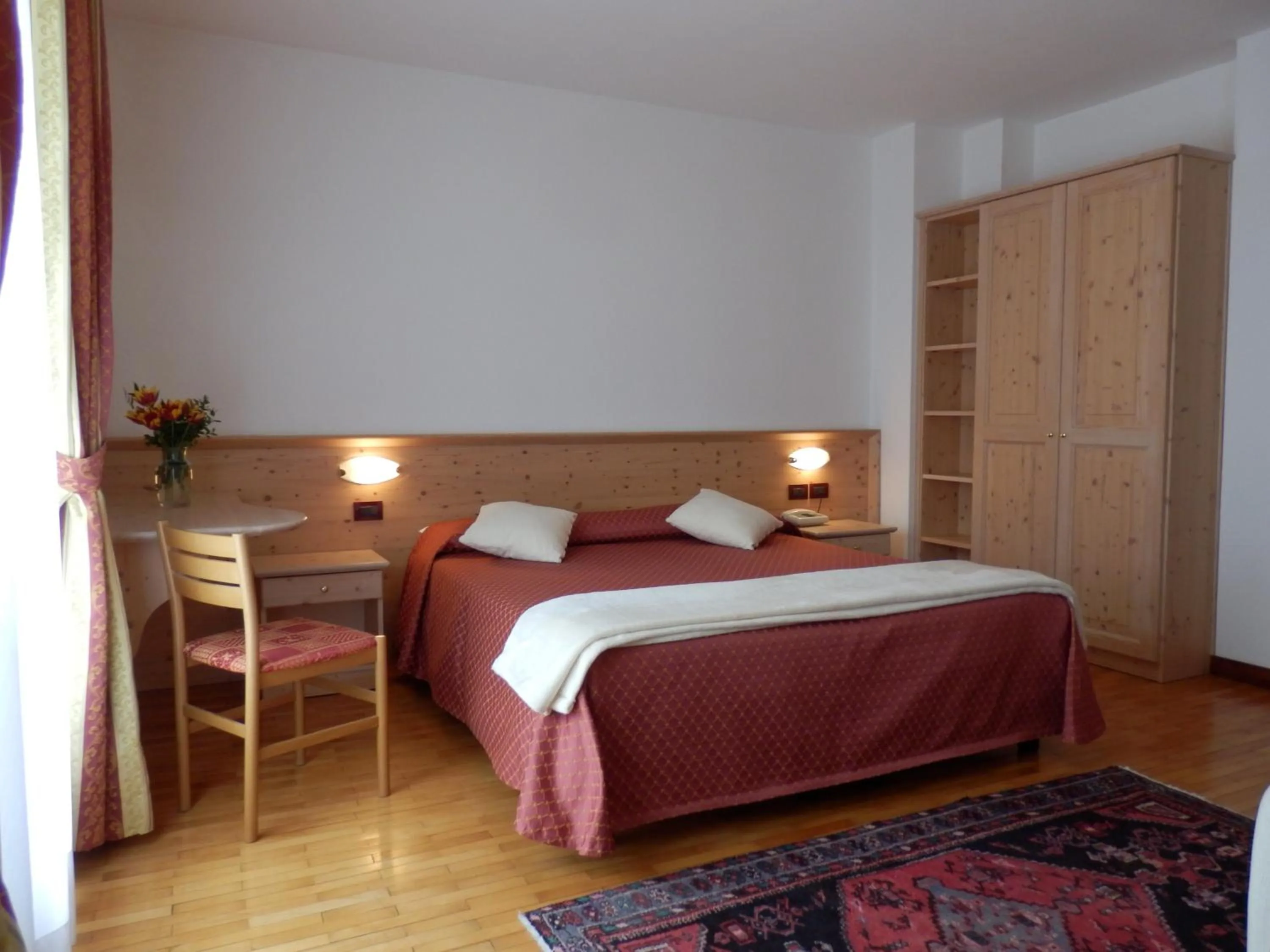 Bed in Hotel Dolomiti