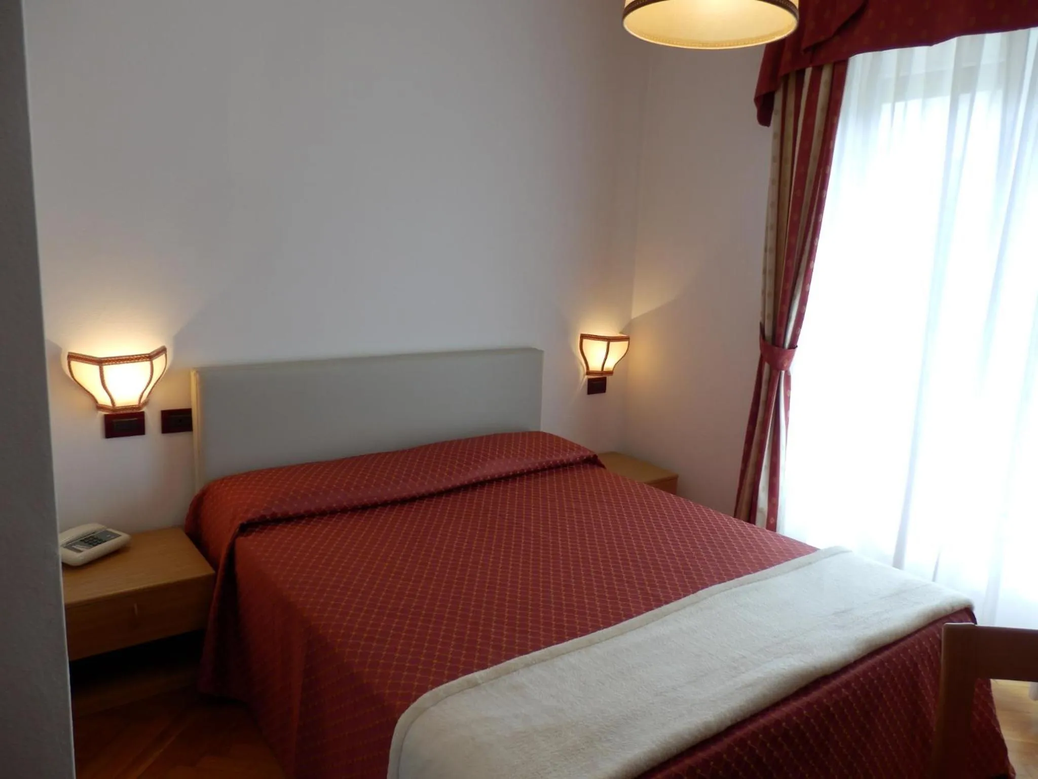 Bed in Hotel Dolomiti