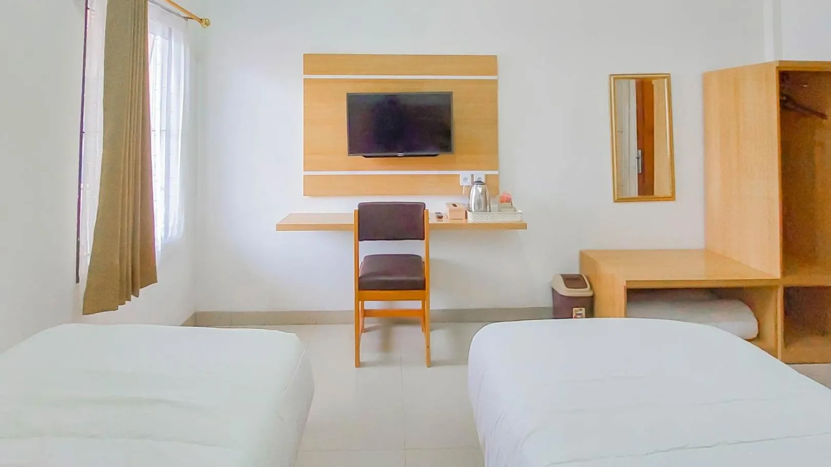 Bed in Urbanview Hotel Bundaran Besar Palangkaraya by RedDoorz