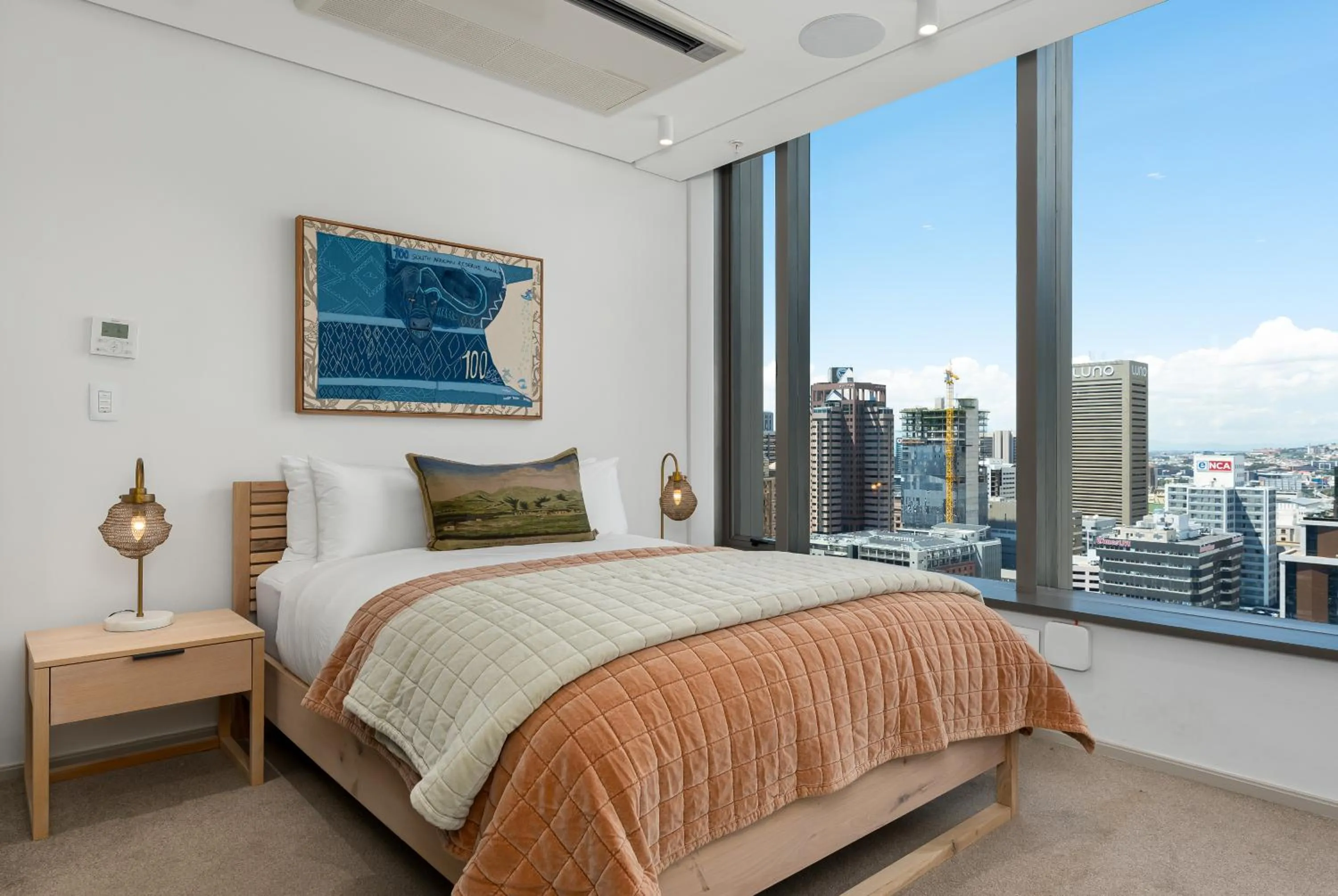 Bed in 117 on Strand Luxury Apartments