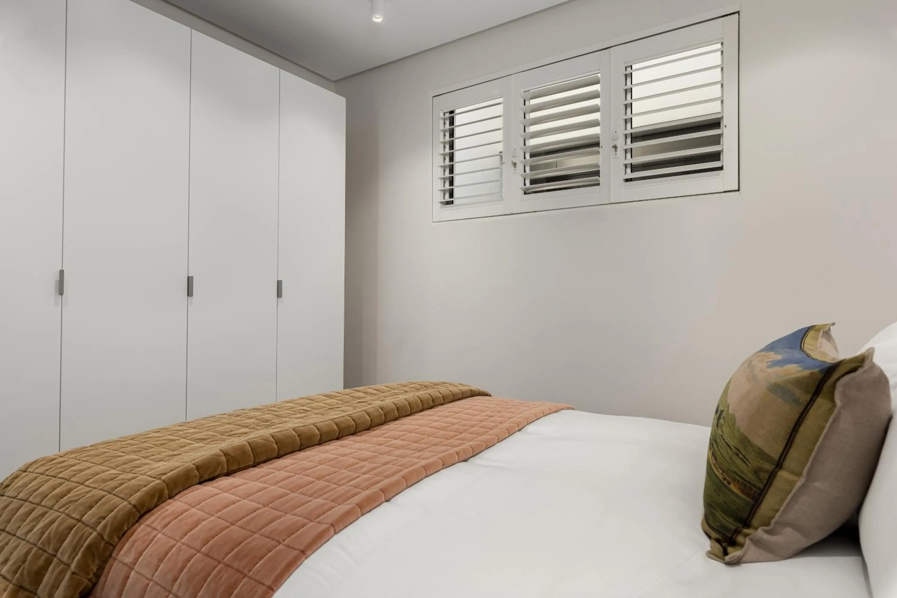 Bed in 117 on Strand Luxury Apartments