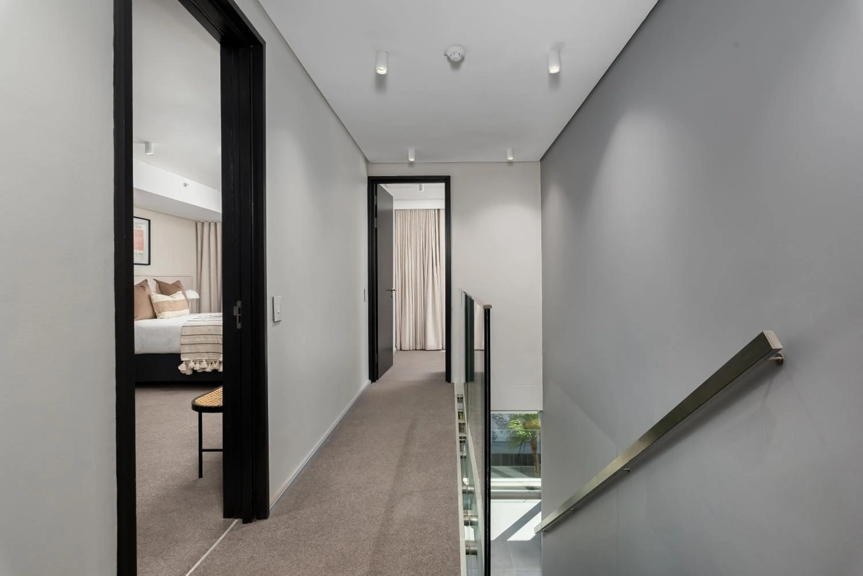 Bed in 117 on Strand Luxury Apartments