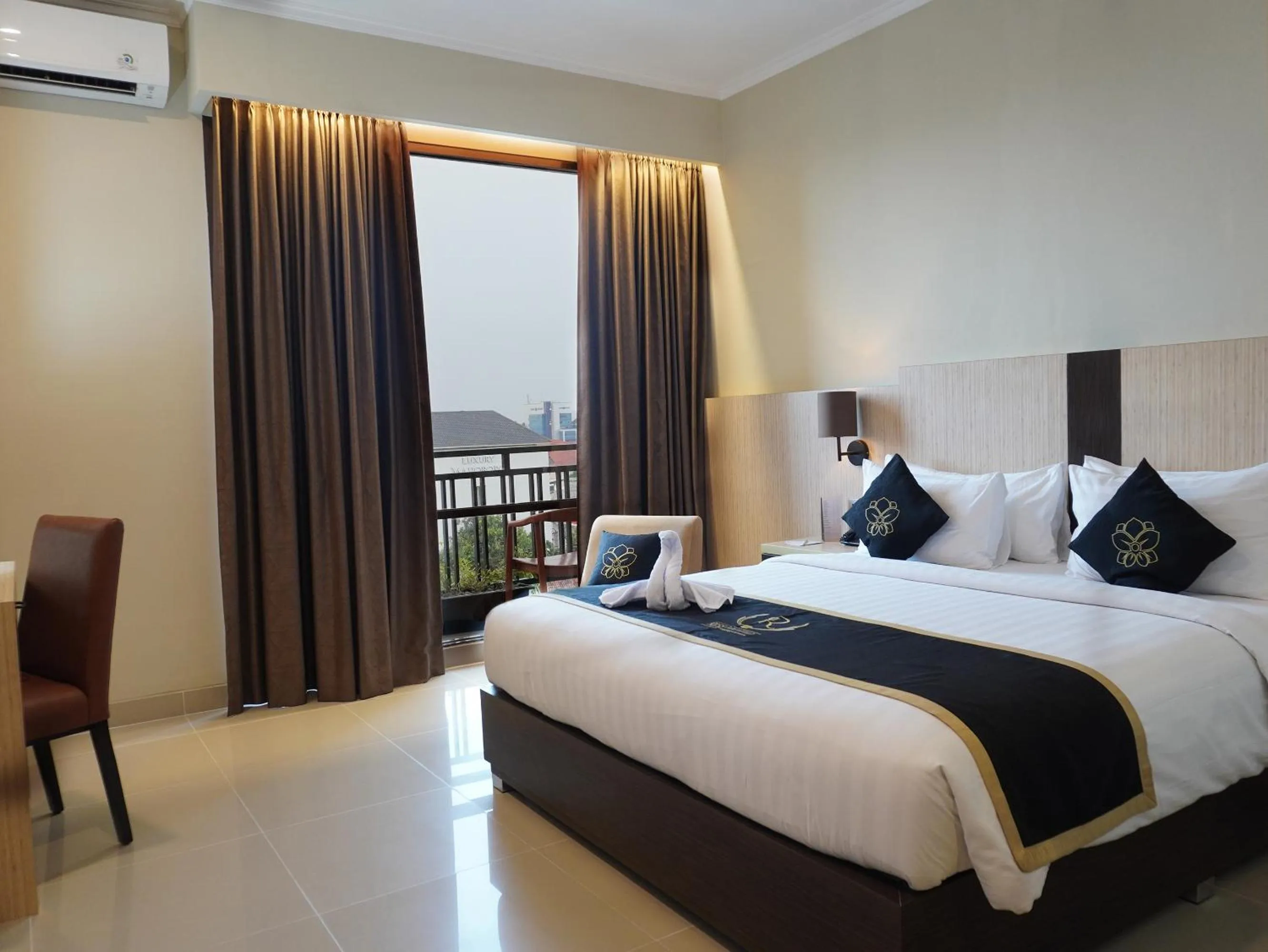 Bed in Riss Hotel Malioboro