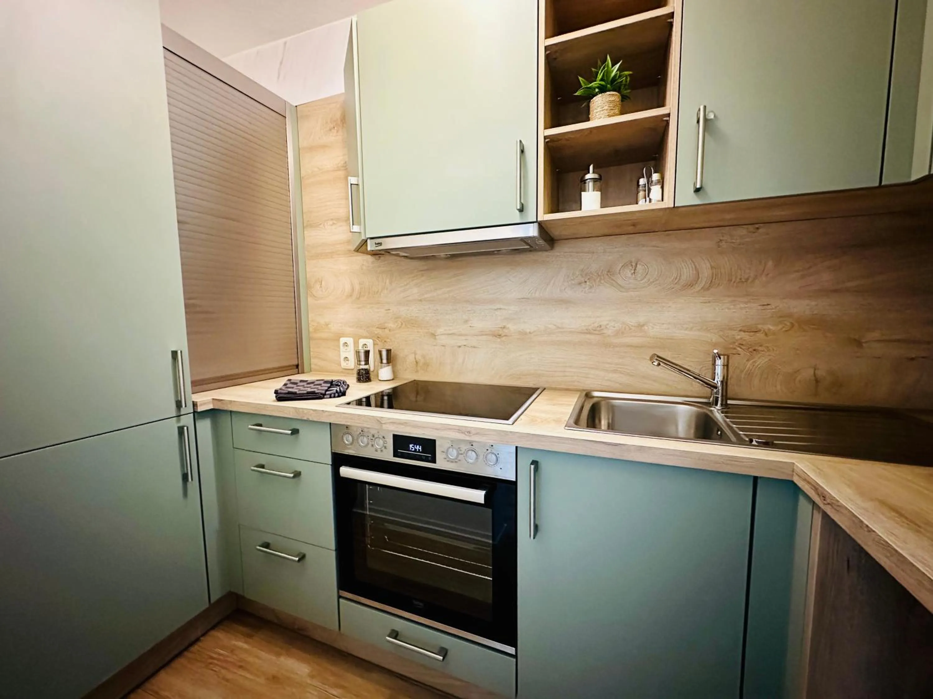 Kitchen or kitchenette in Nanis Hotel & Appartements