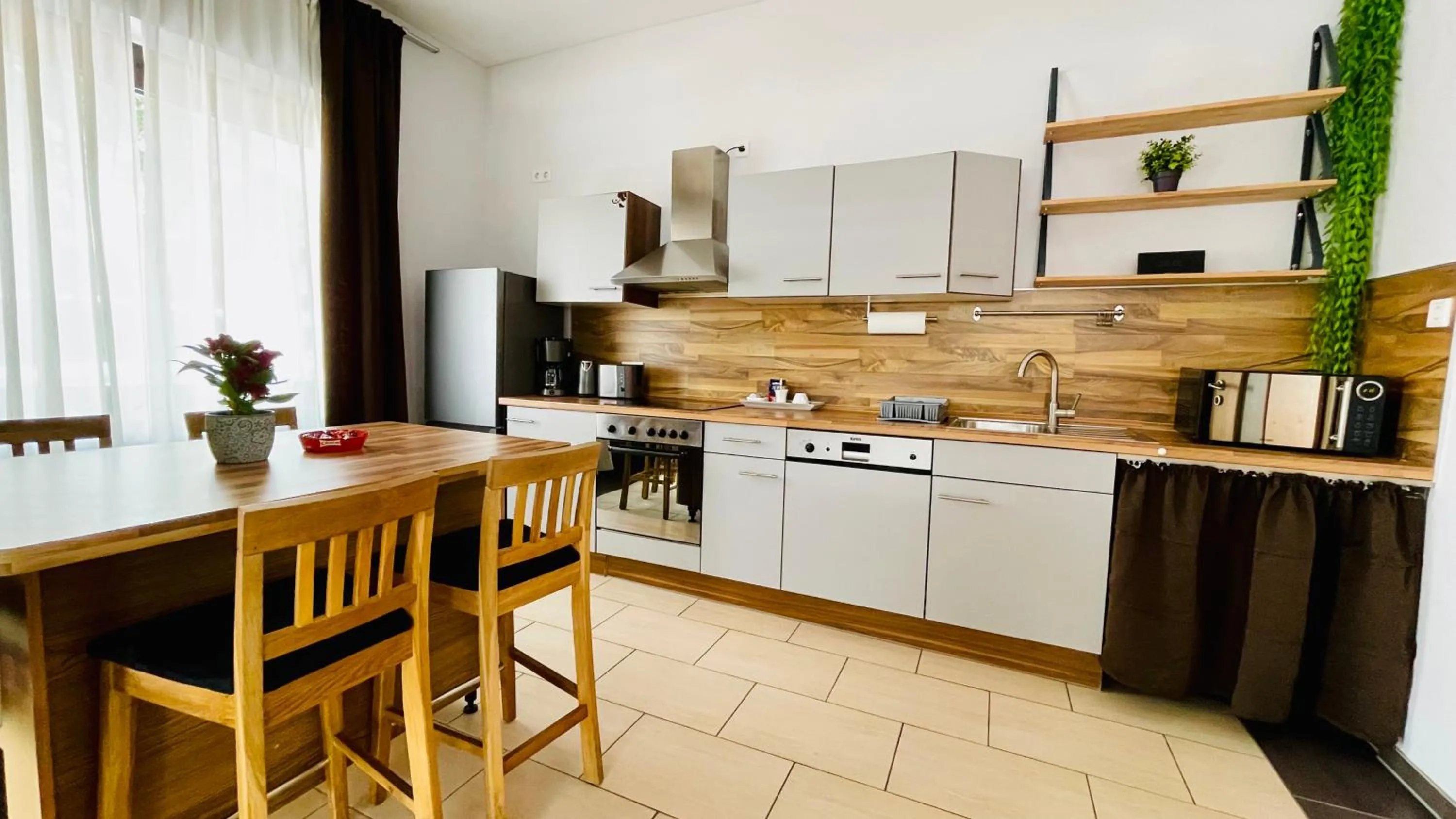 Kitchen or kitchenette in Nanis Hotel & Appartements