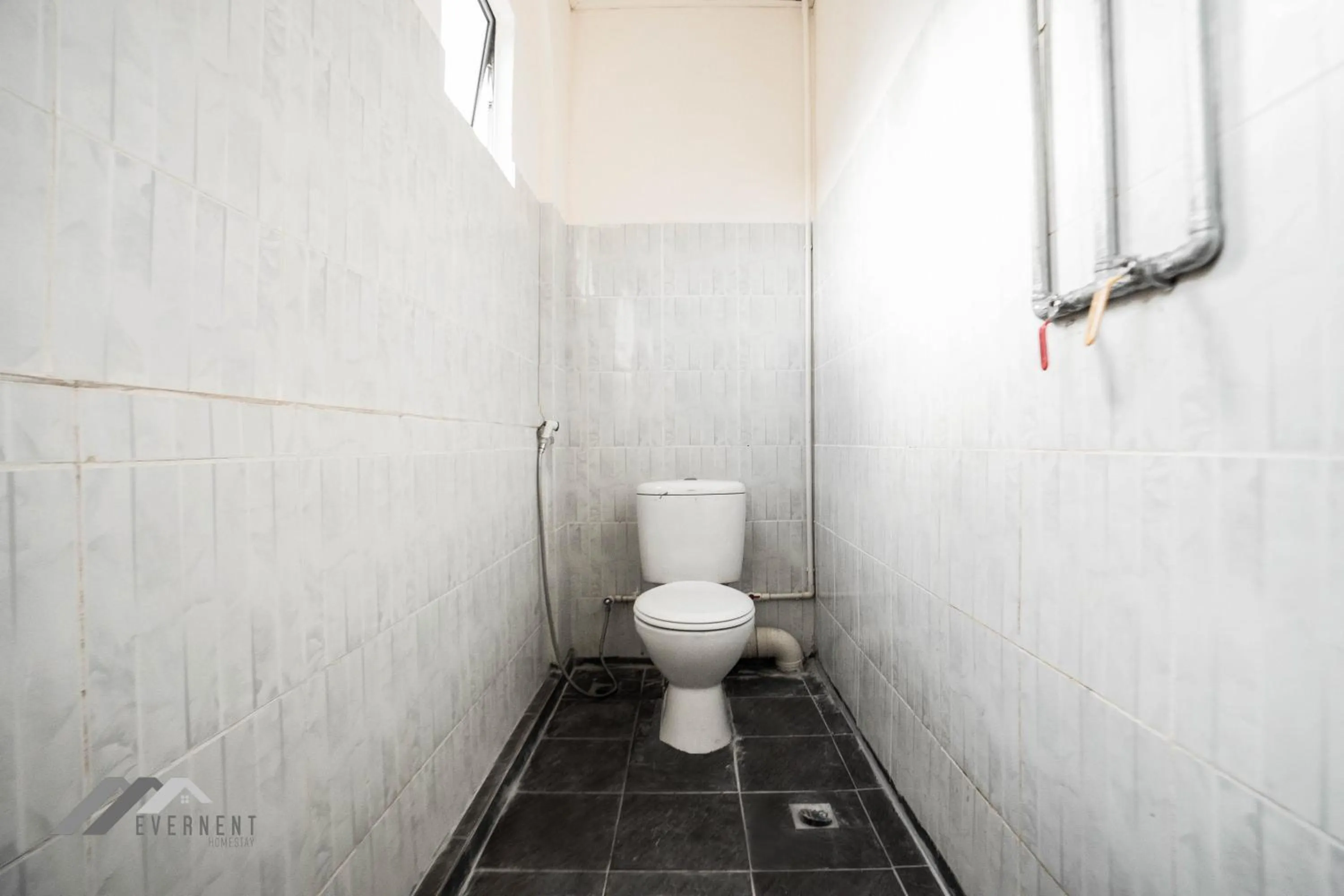 Bathroom in Permaisuri Homestay by Evernent