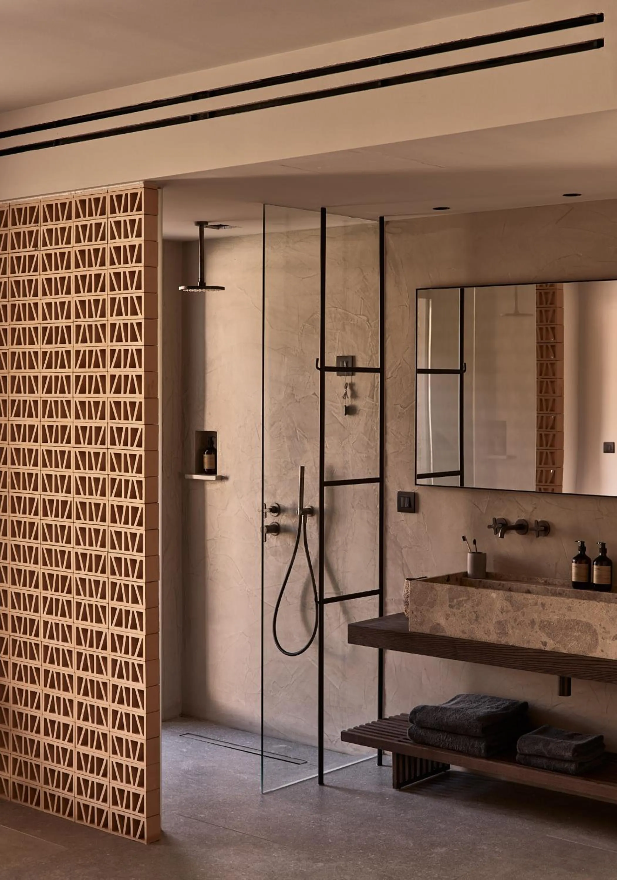 Bathroom in Theros All Suite Hotel - Adults Only