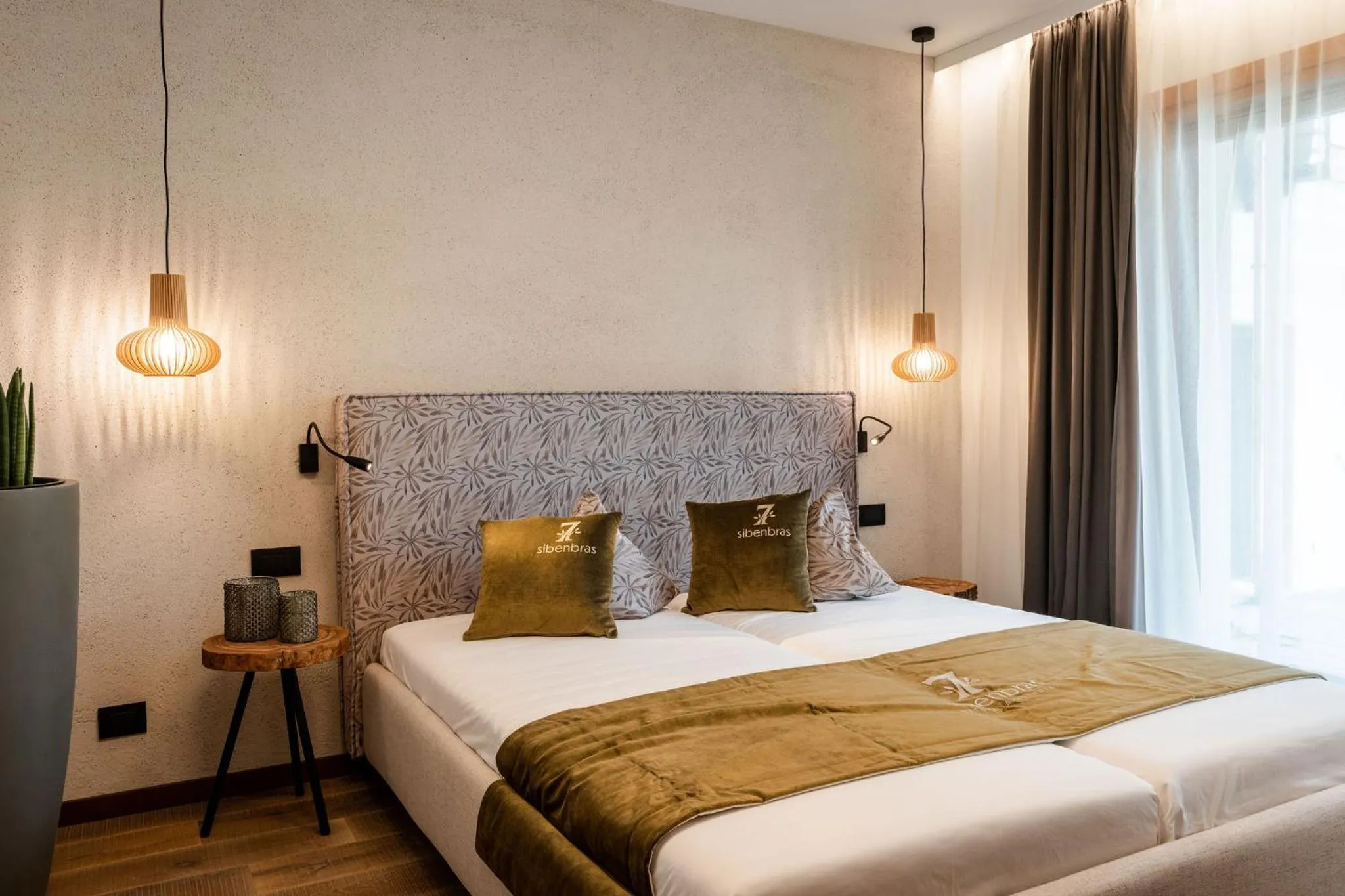 Bed in Sibenbras Natural Aparthotel