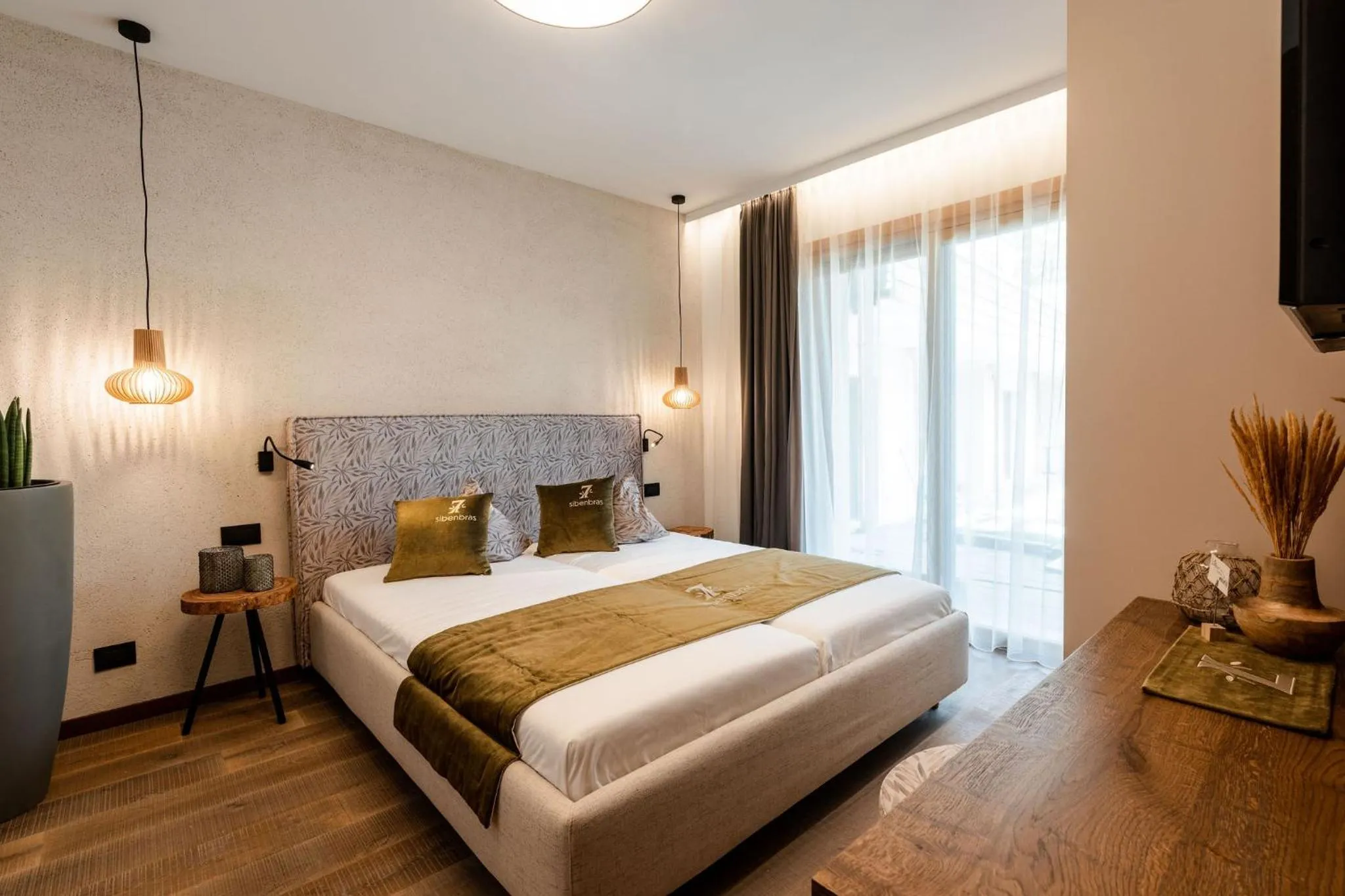 Bed in Sibenbras Natural Aparthotel