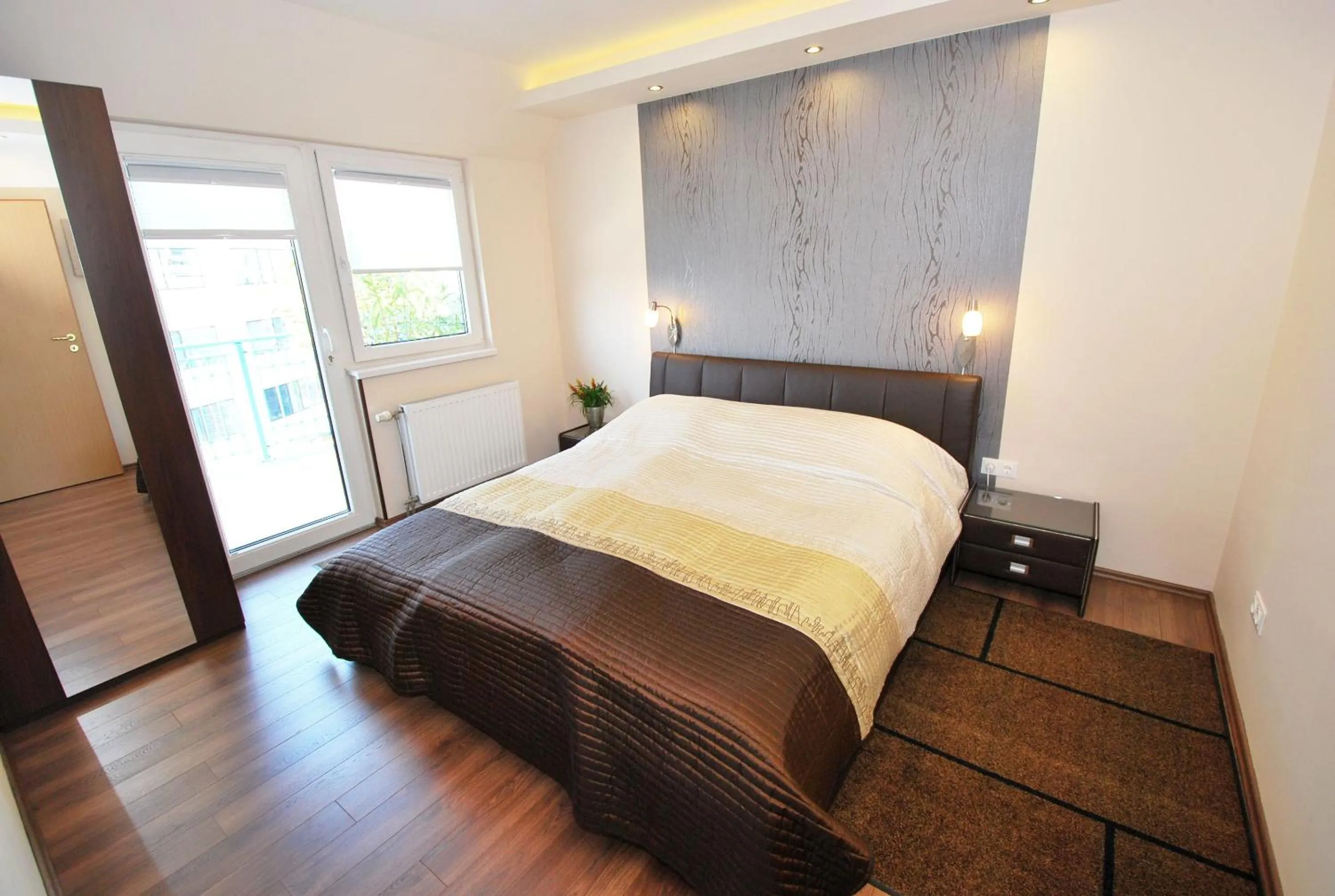 Bed in Arpad Bridge Apartments