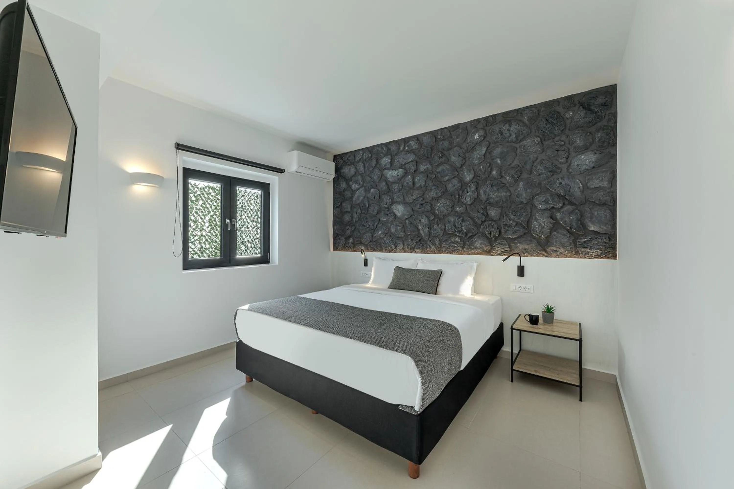 Bed in Onyx Hotel & Suites