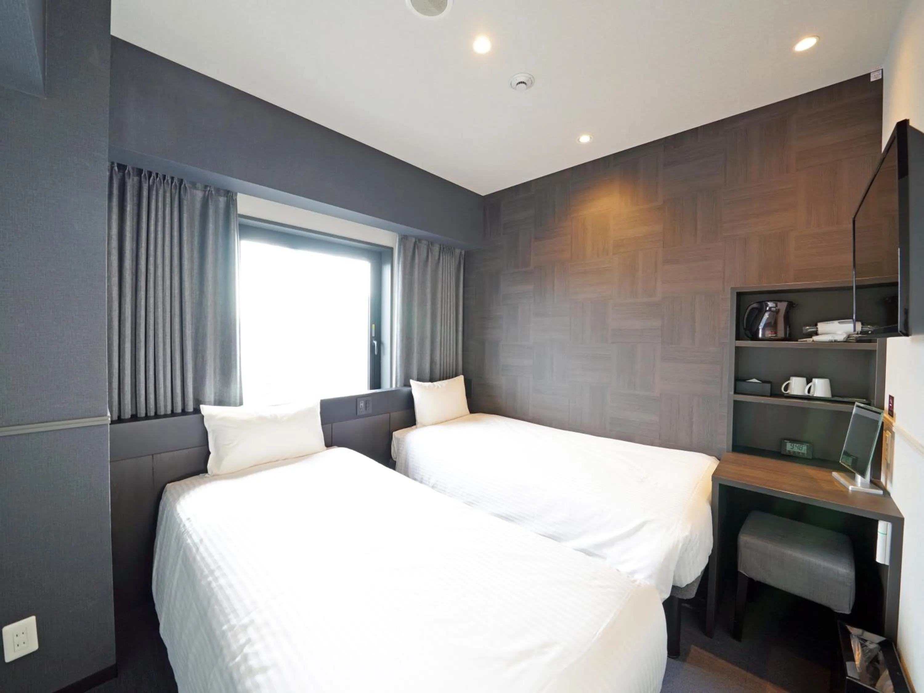 Bed in CHISUN STANDARD Osaka Shin-Imamiya