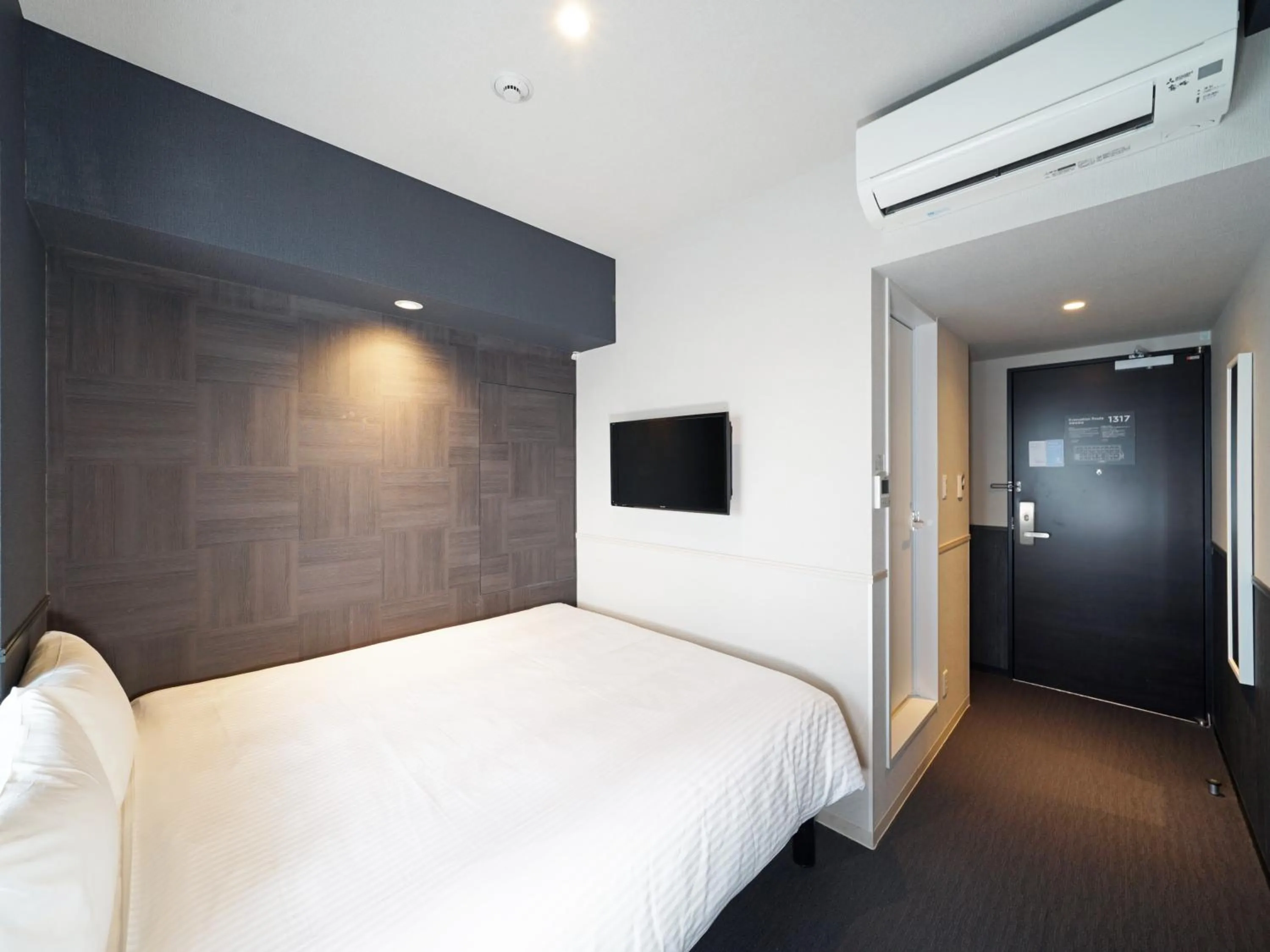 Bed in CHISUN STANDARD Osaka Shin-Imamiya