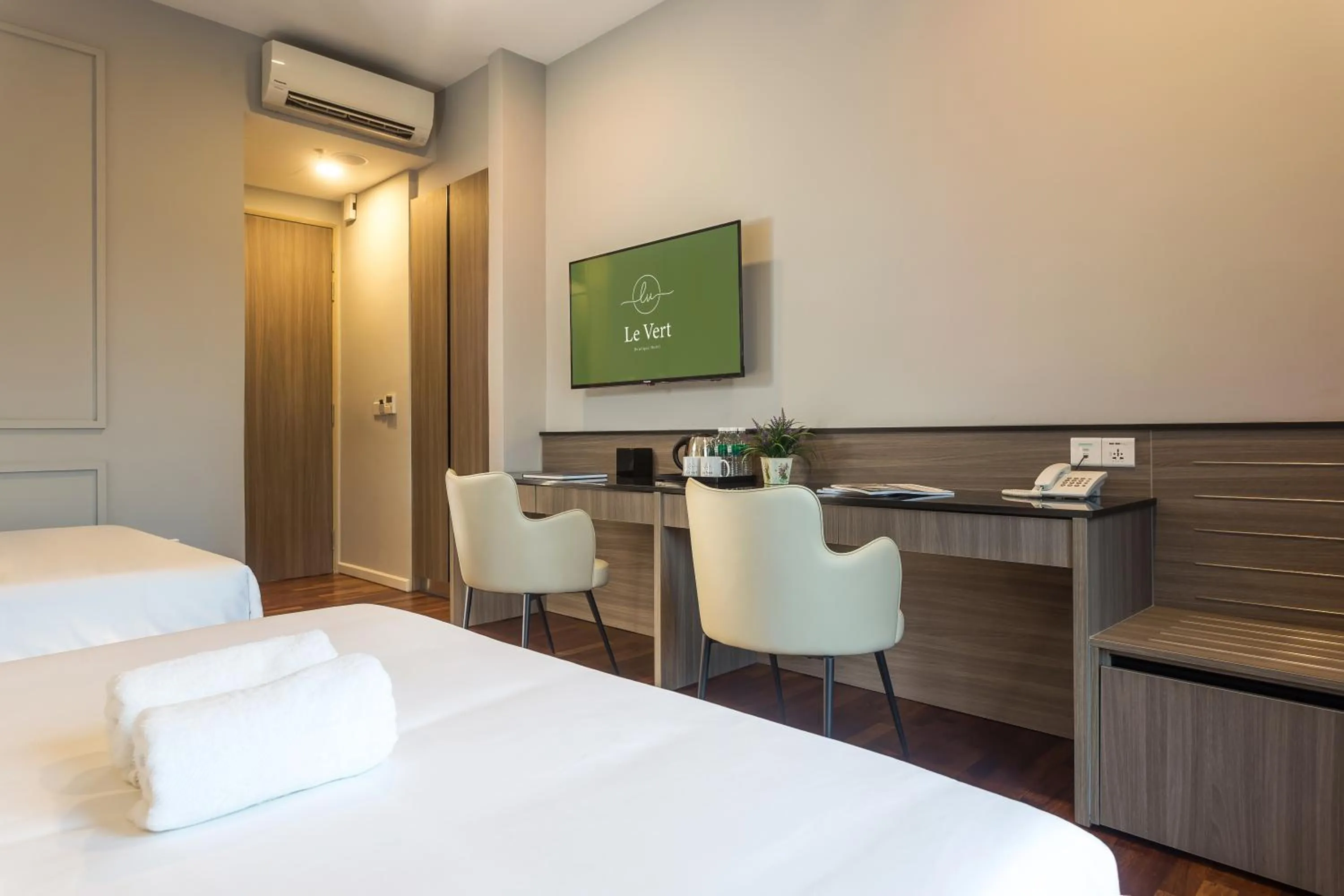 Bed in Le Vert Boutique Hotel