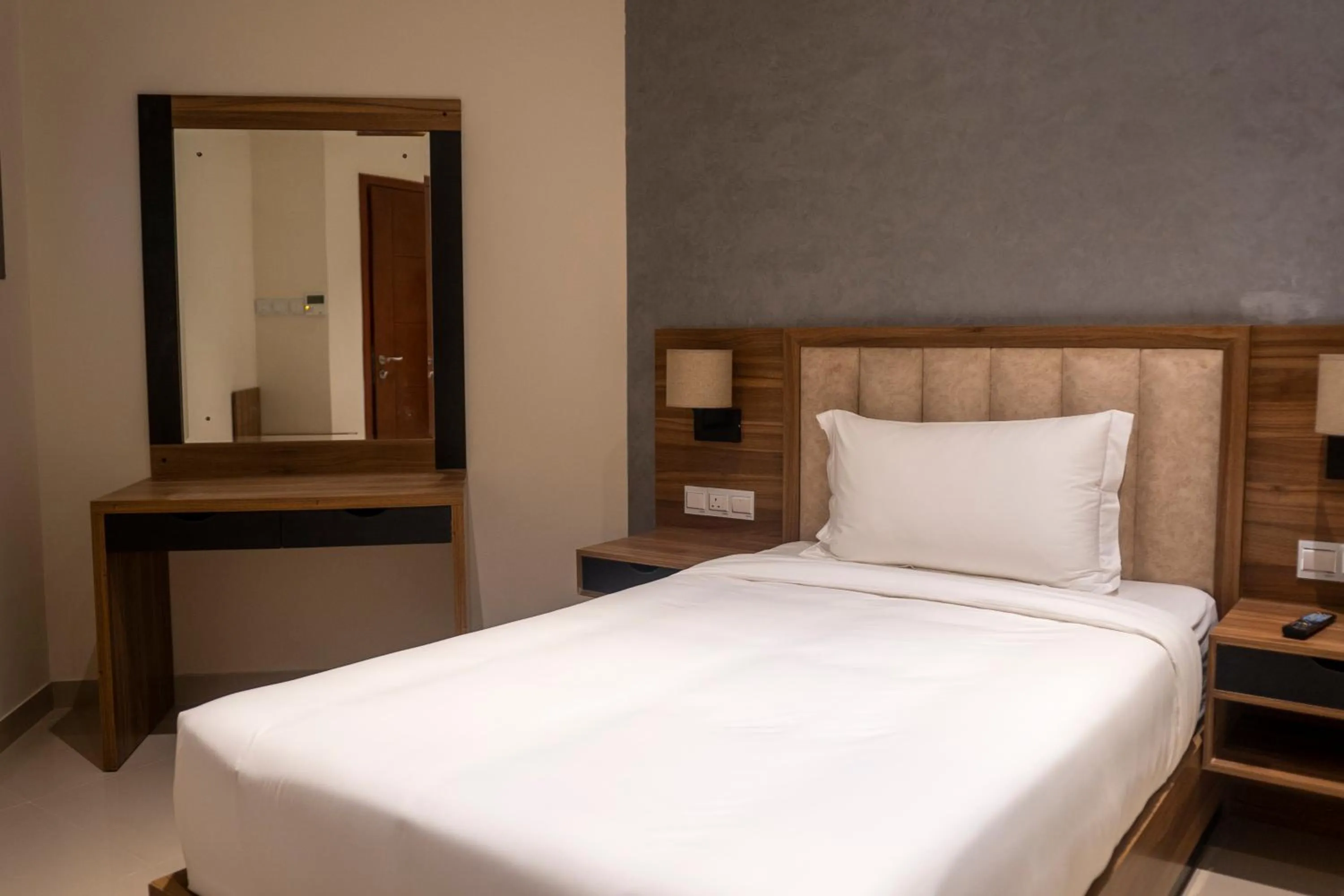 Bed in The Plaza Hotel & Resort