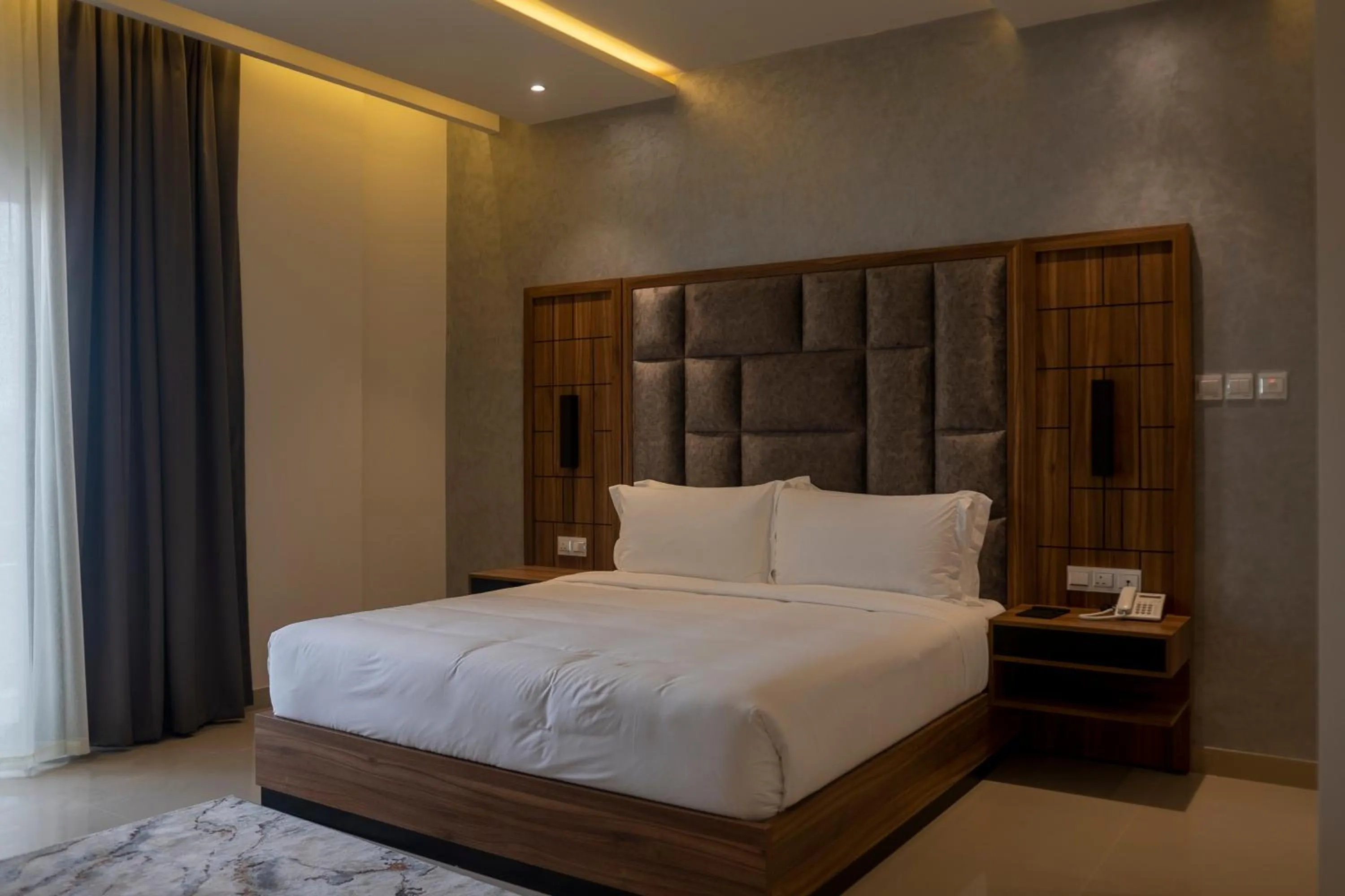 Bed in The Plaza Hotel & Resort