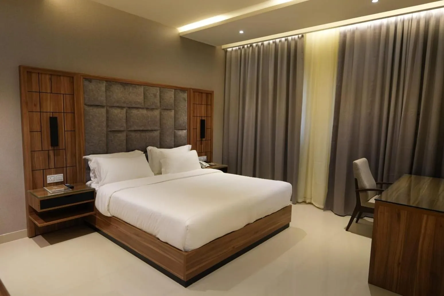 Bed in The Plaza Hotel & Resort