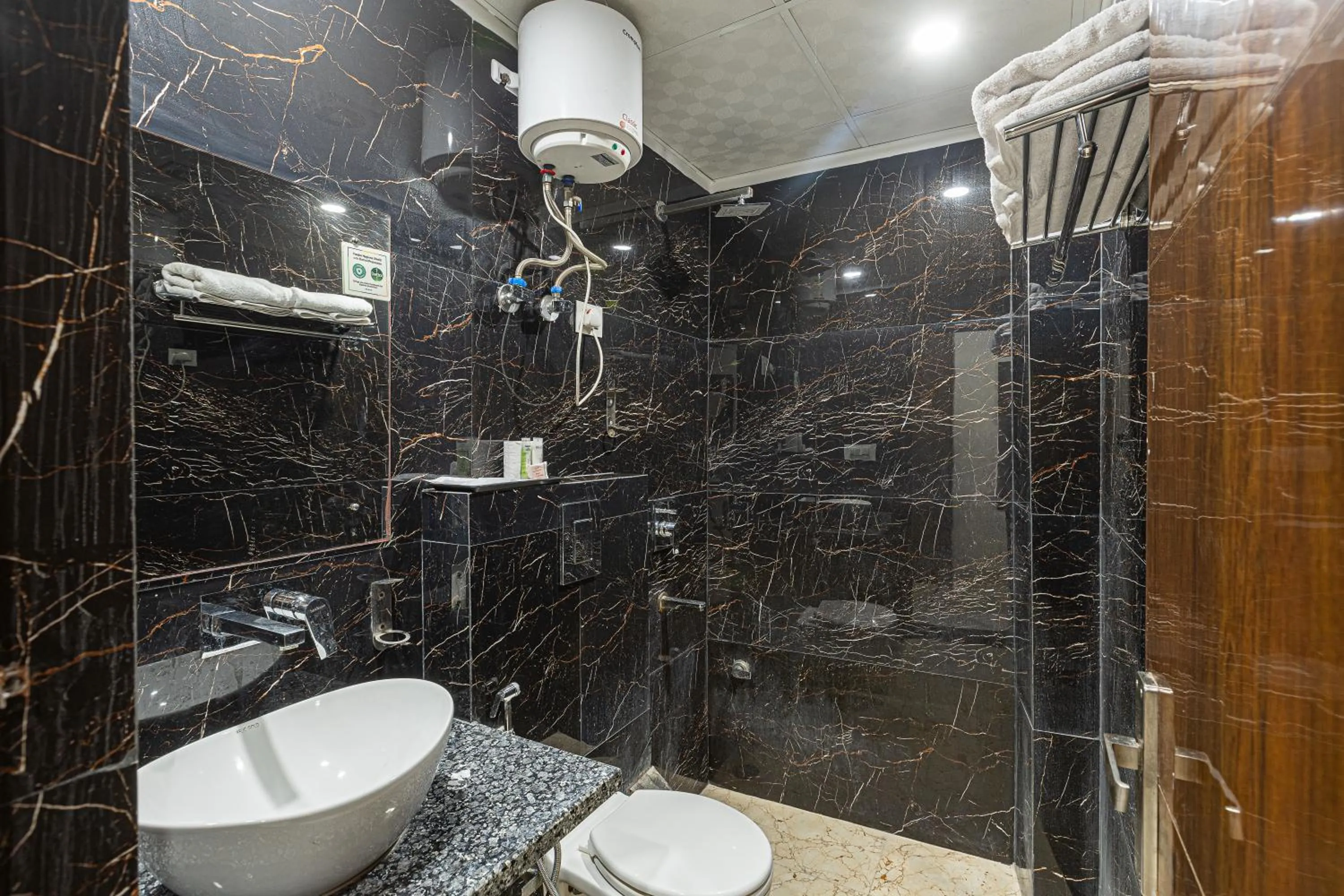 Bathroom in Hotel Emblem Suites Delhi Airport - Free Airport Pickup or Drop