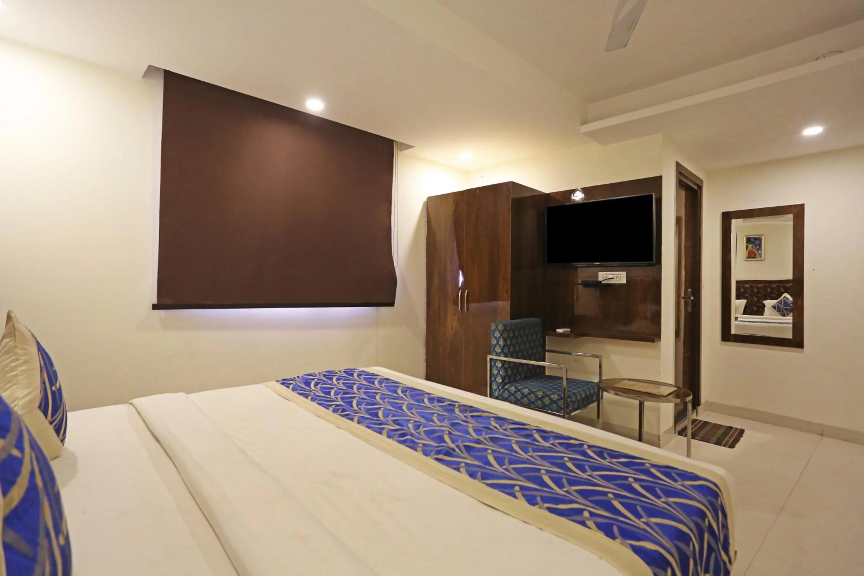 TV and multimedia, Bed in Hotel Emblem Suites Delhi Airport - Free Airport Pickup or Drop