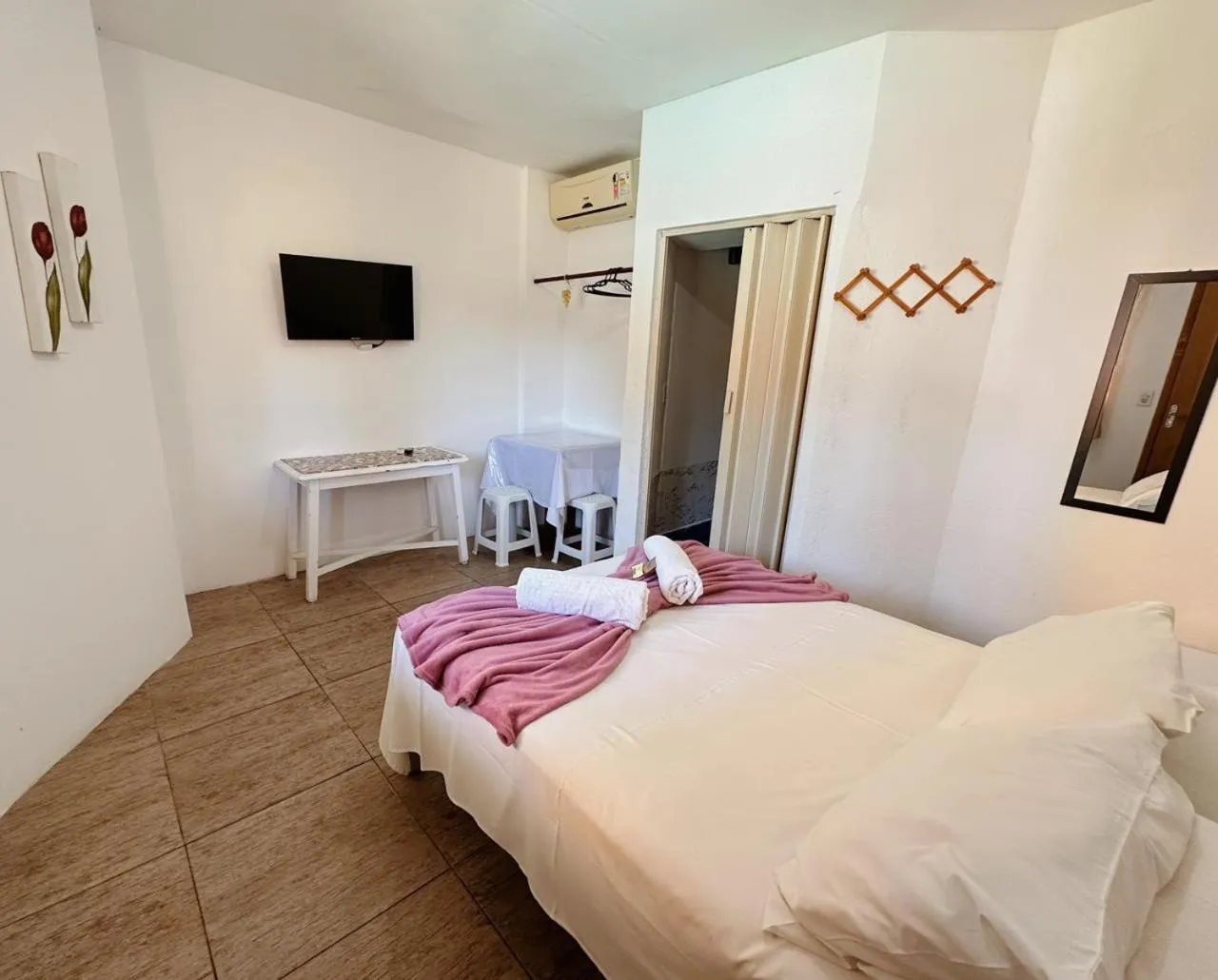 Bed in Pousada Ponta dos Corais