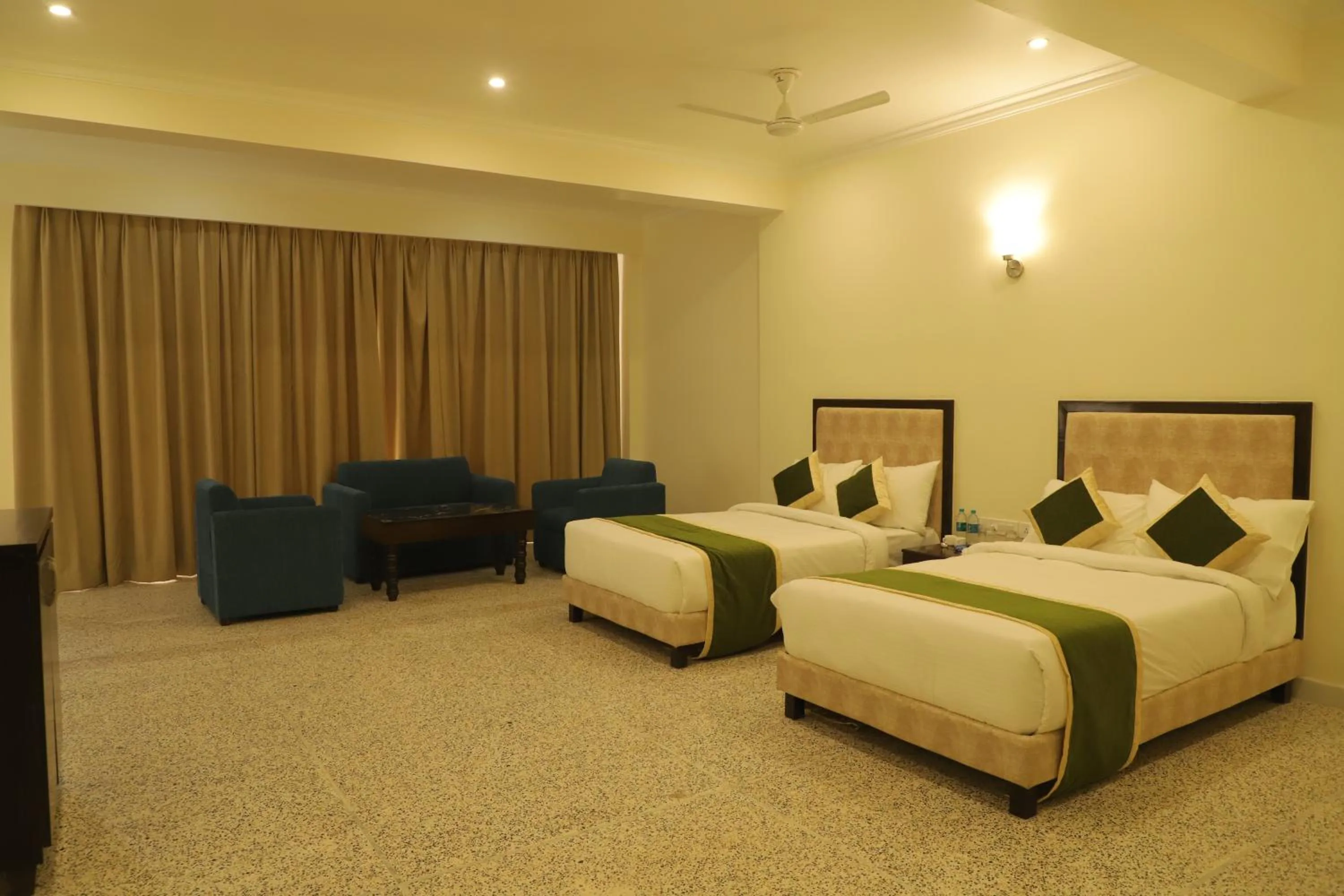 Bed in Gautam Hotels & Resorts