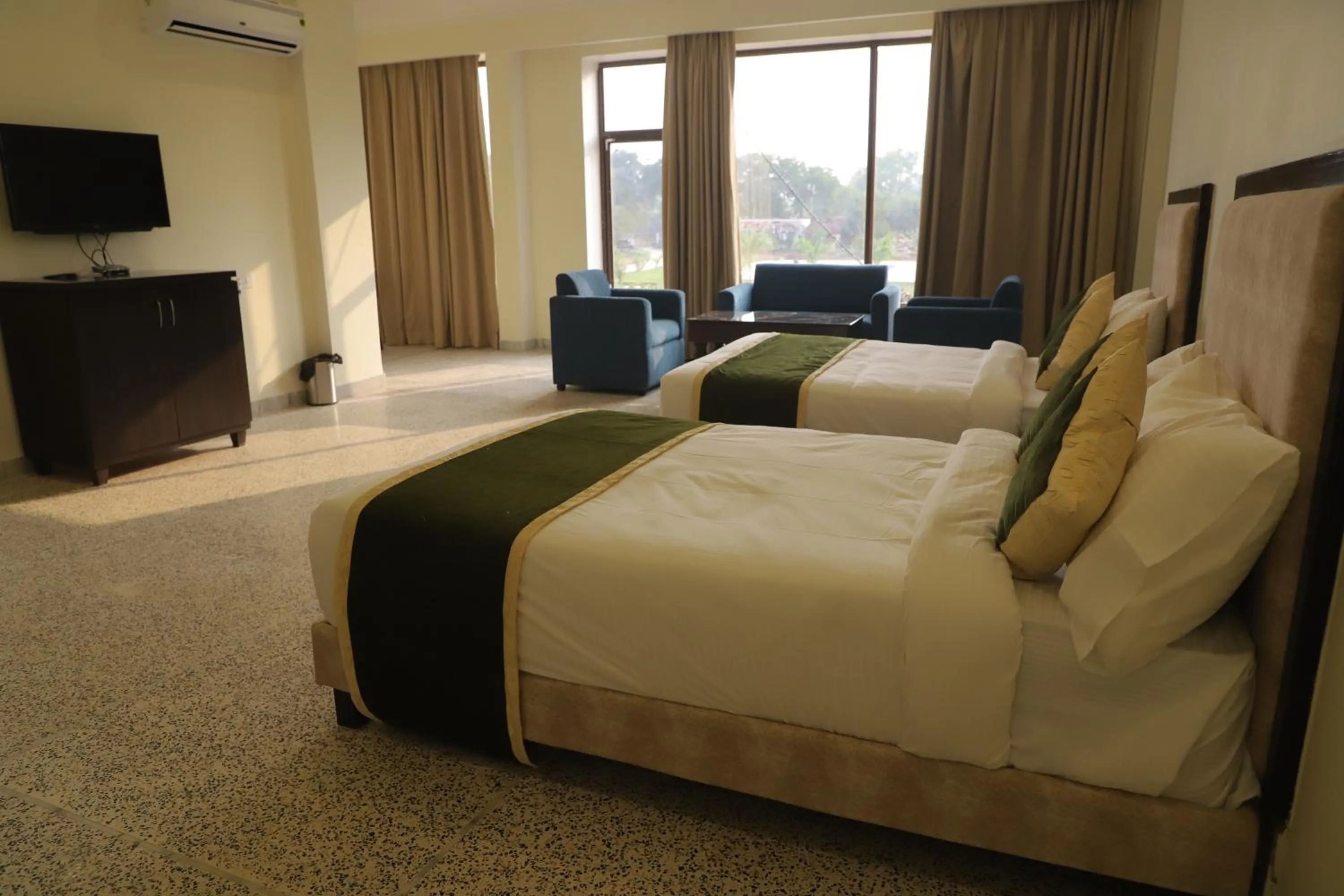 Bed in Gautam Hotels & Resorts