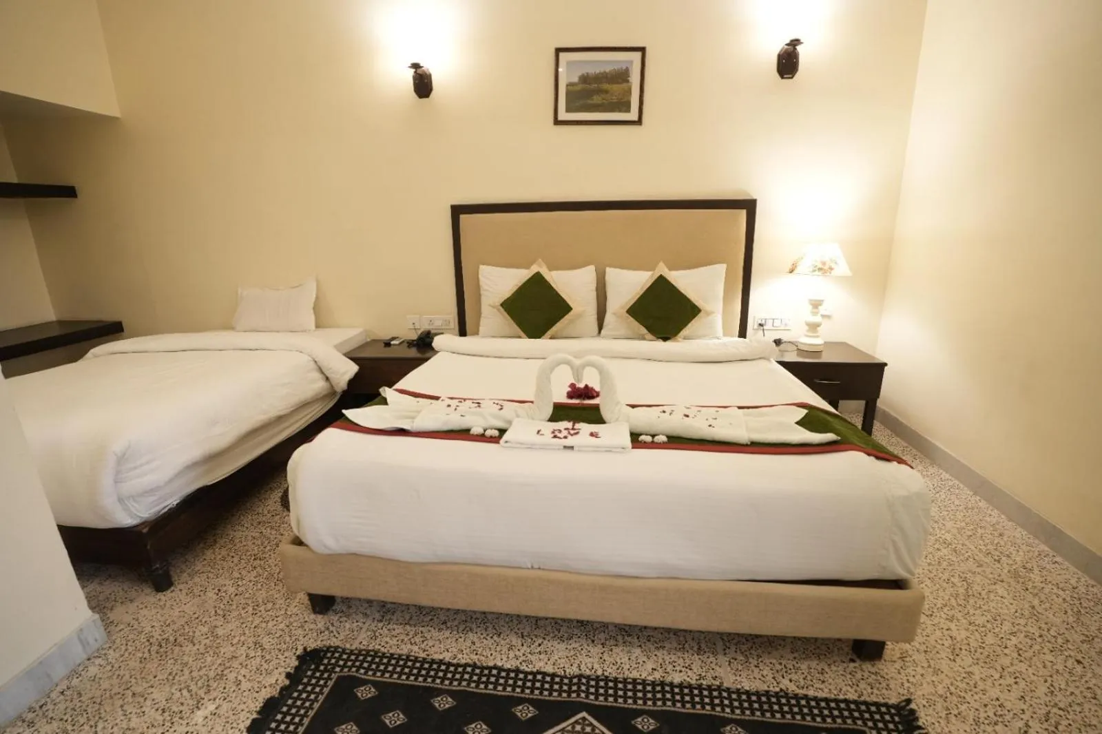 Bed in Gautam Hotels & Resorts