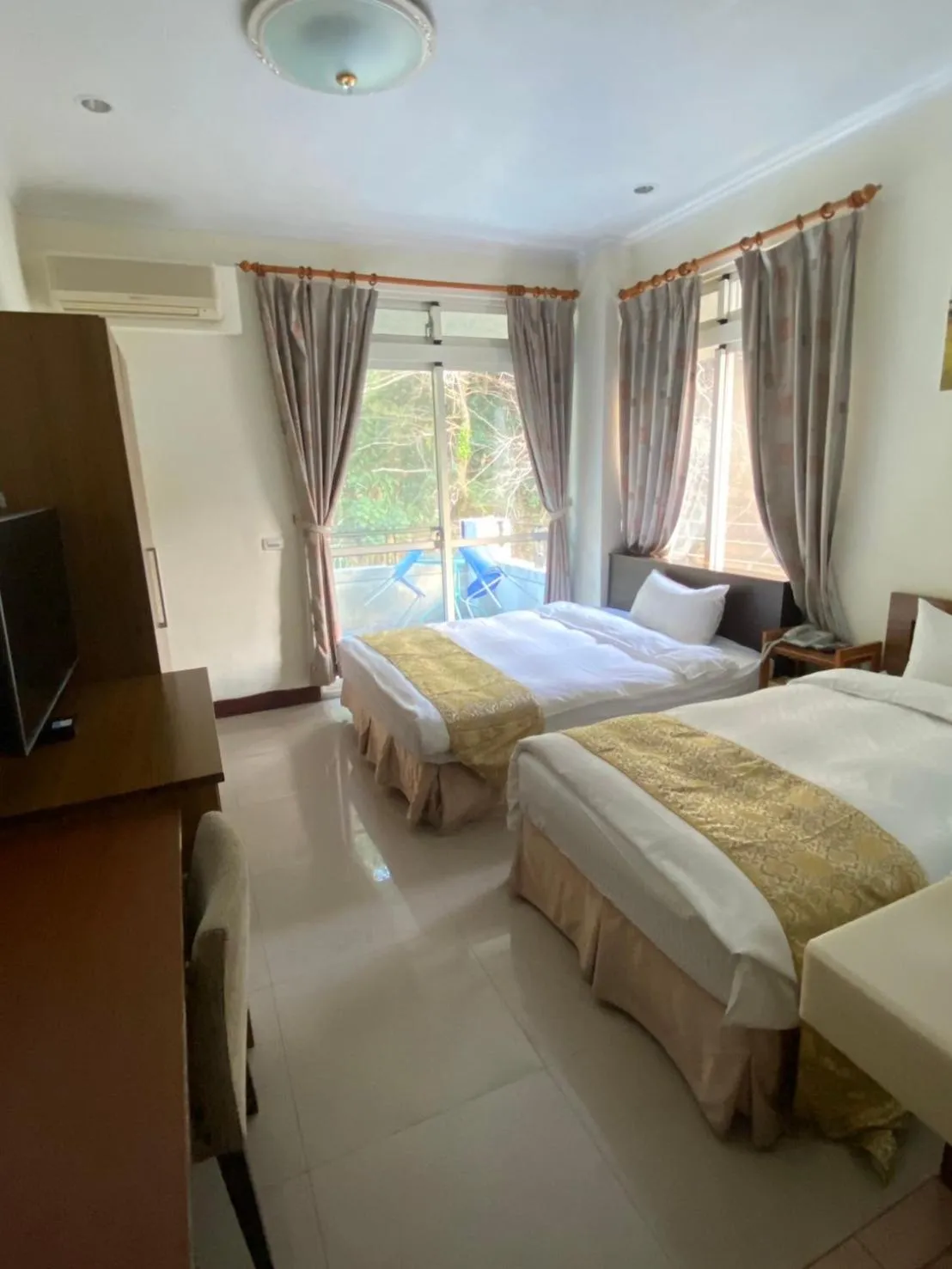 Bed in Zen and Pine Resort