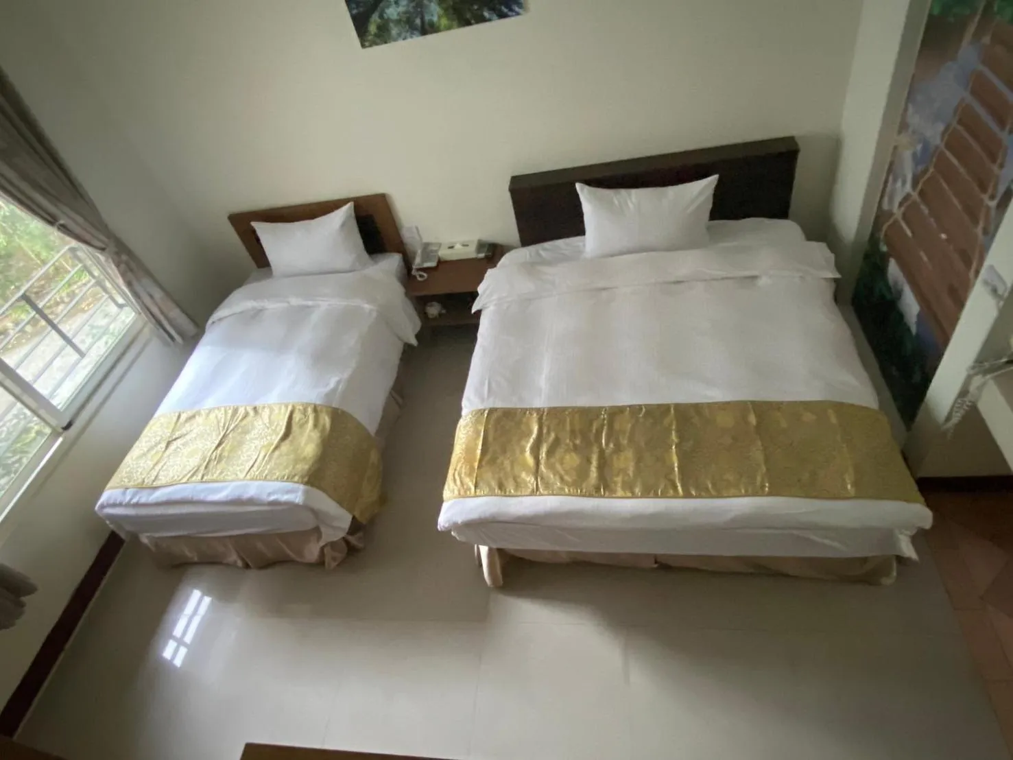 Bed in Zen and Pine Resort