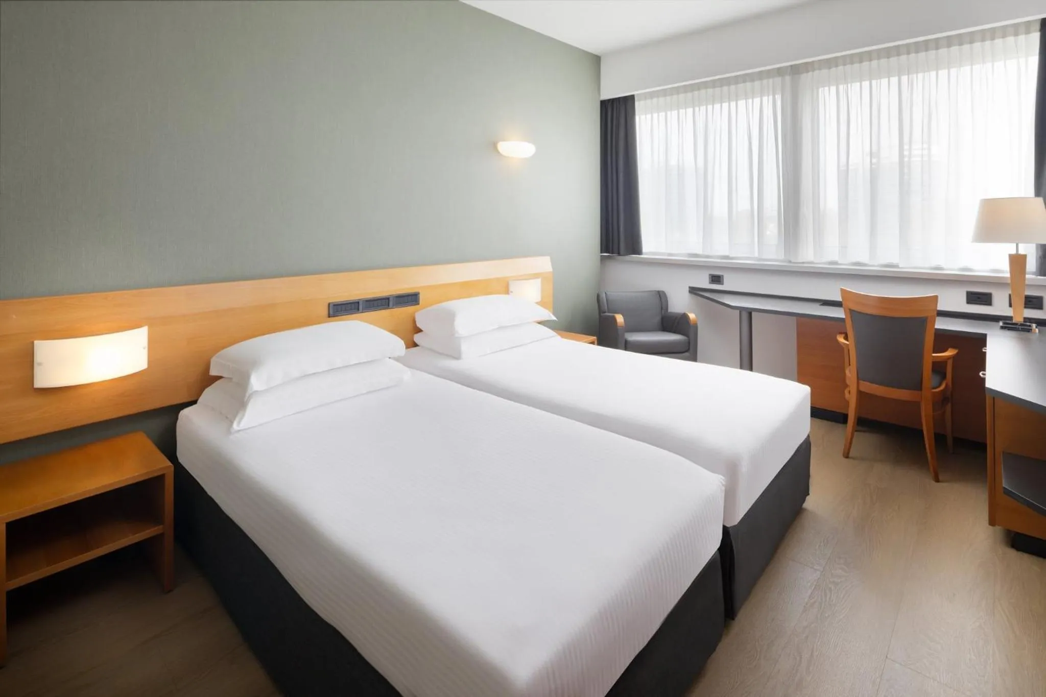 Photo of the whole room, Bed in Crowne Plaza Milan Linate by IHG