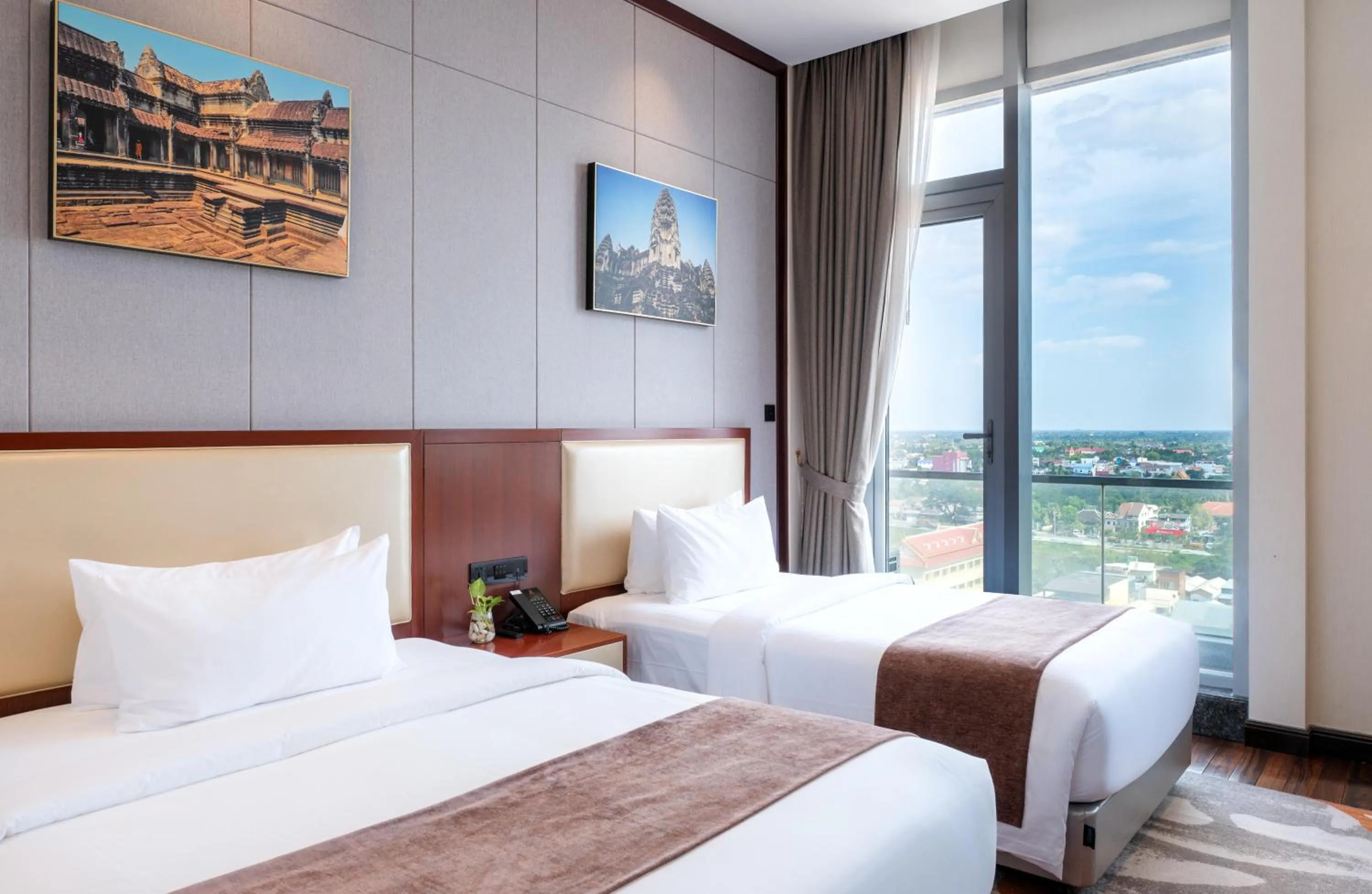 Bed in V V Hotel Battambang