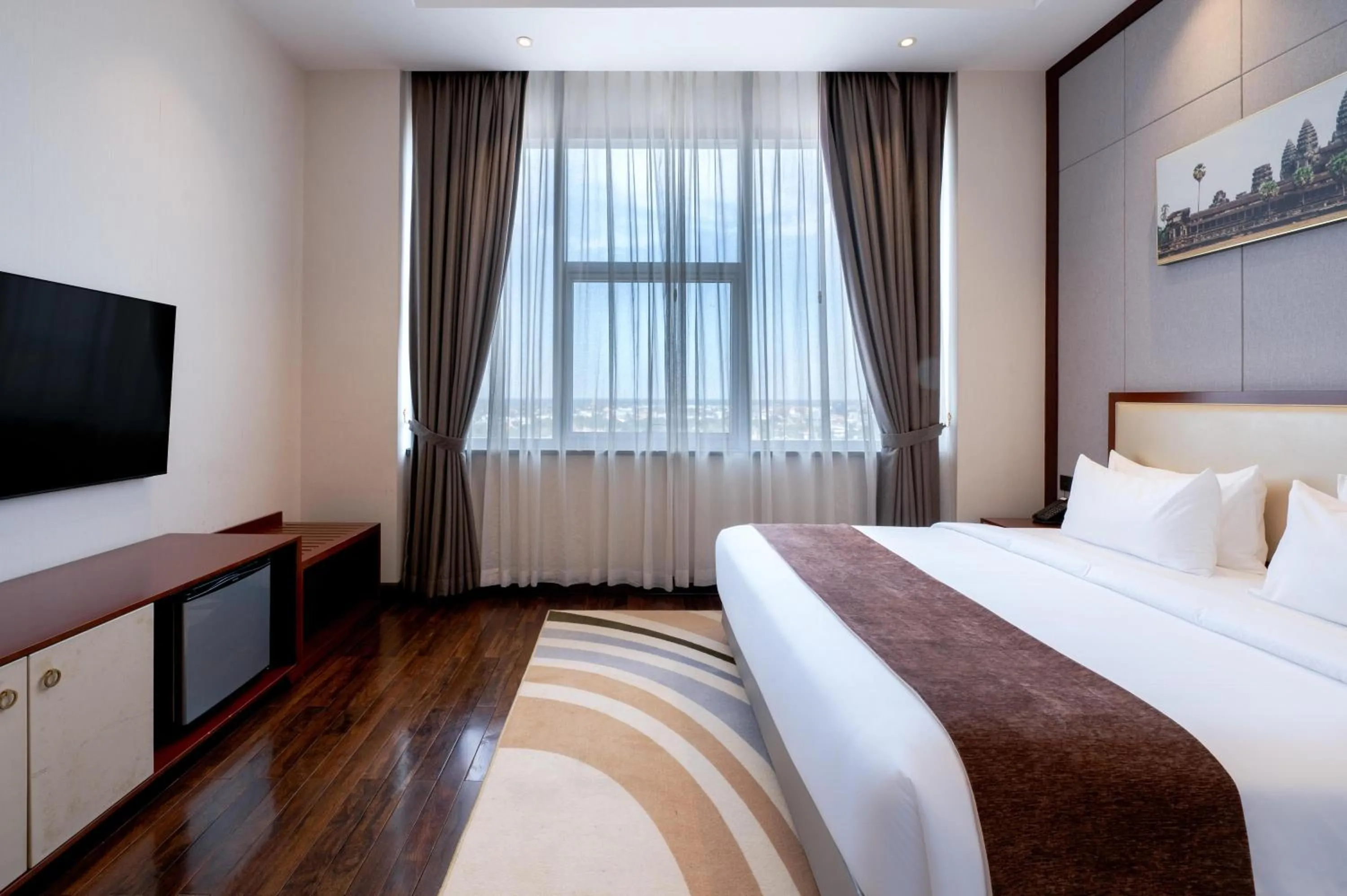 Bed in V V Hotel Battambang