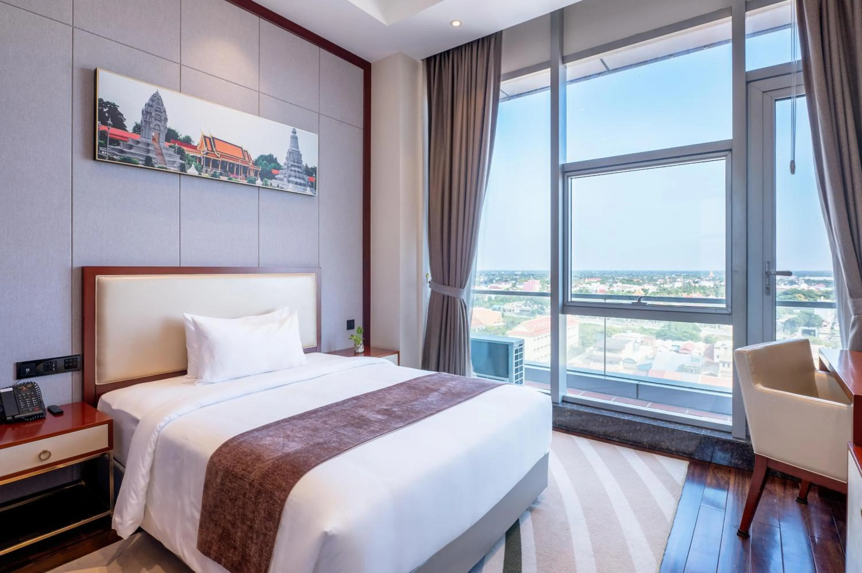 Bed in V V Hotel Battambang