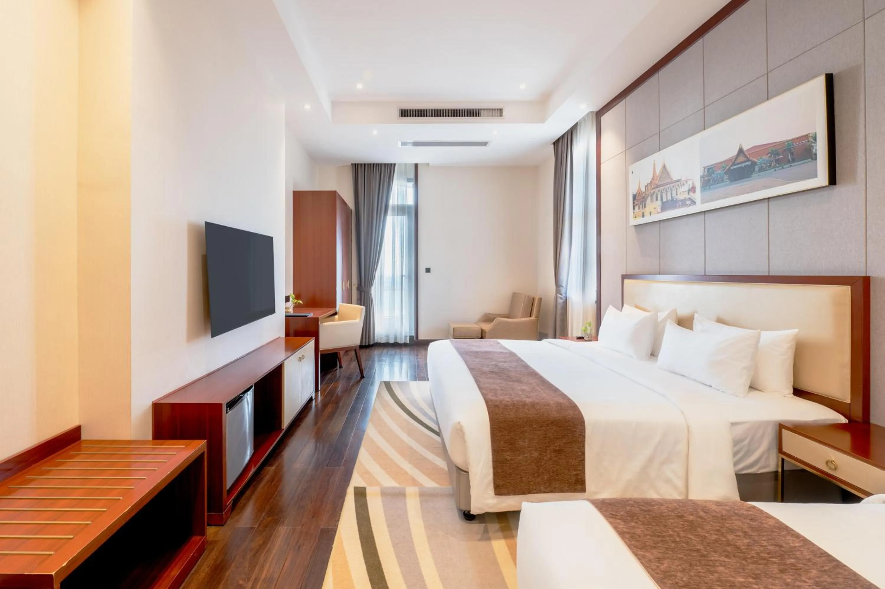 Bed in V V Hotel Battambang