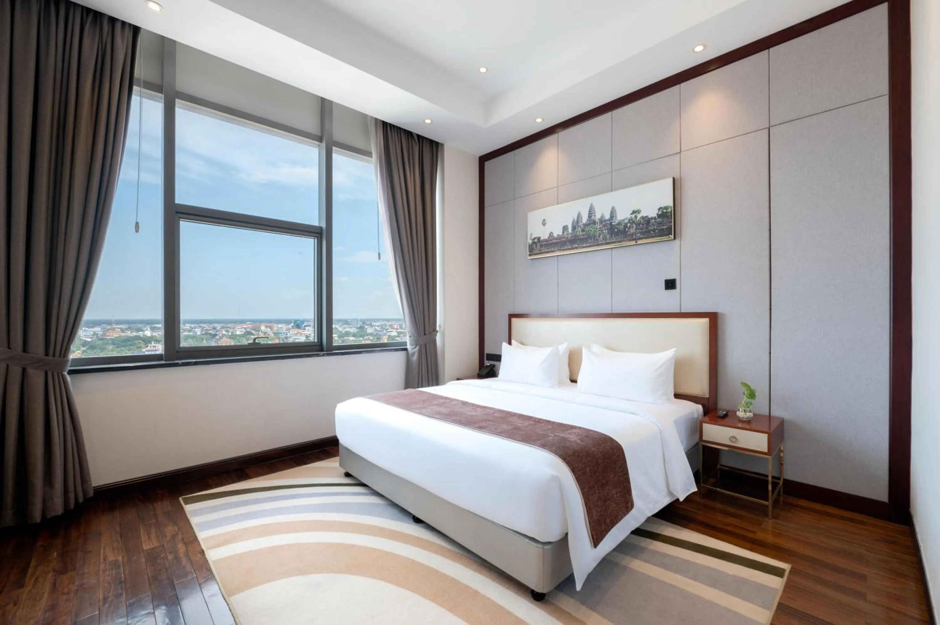 Bed in V V Hotel Battambang