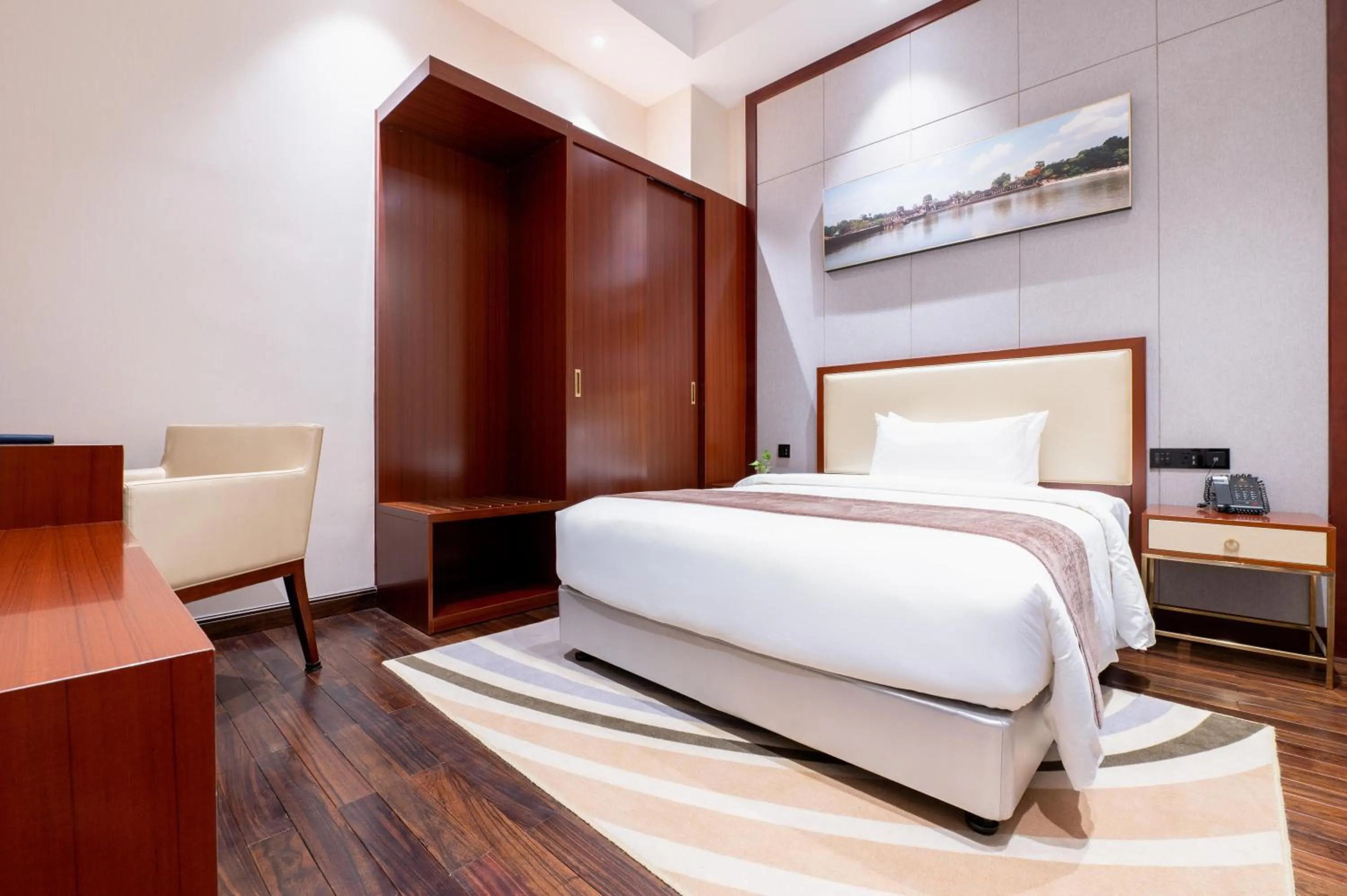 Bed in V V Hotel Battambang