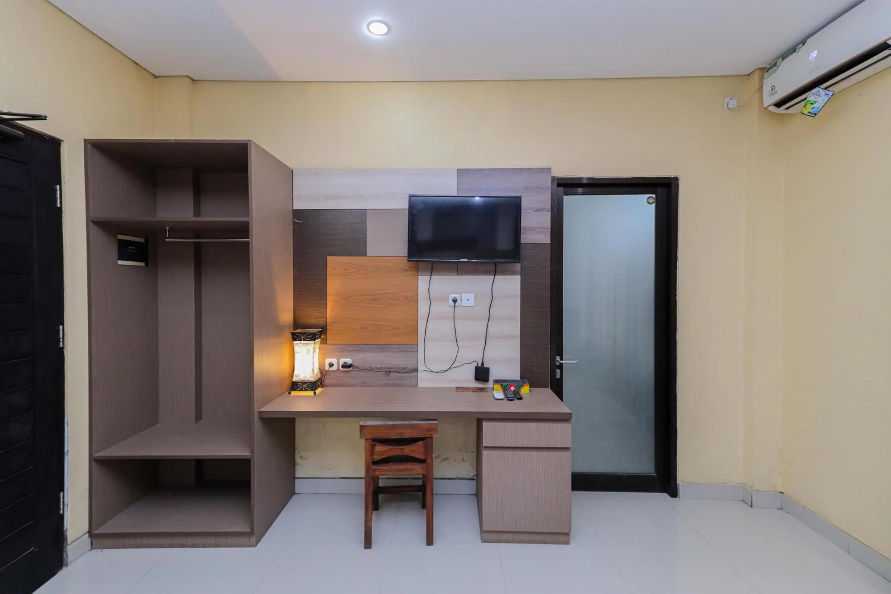wardrobe in Urbanview Hotel WG Jimbaran Bali