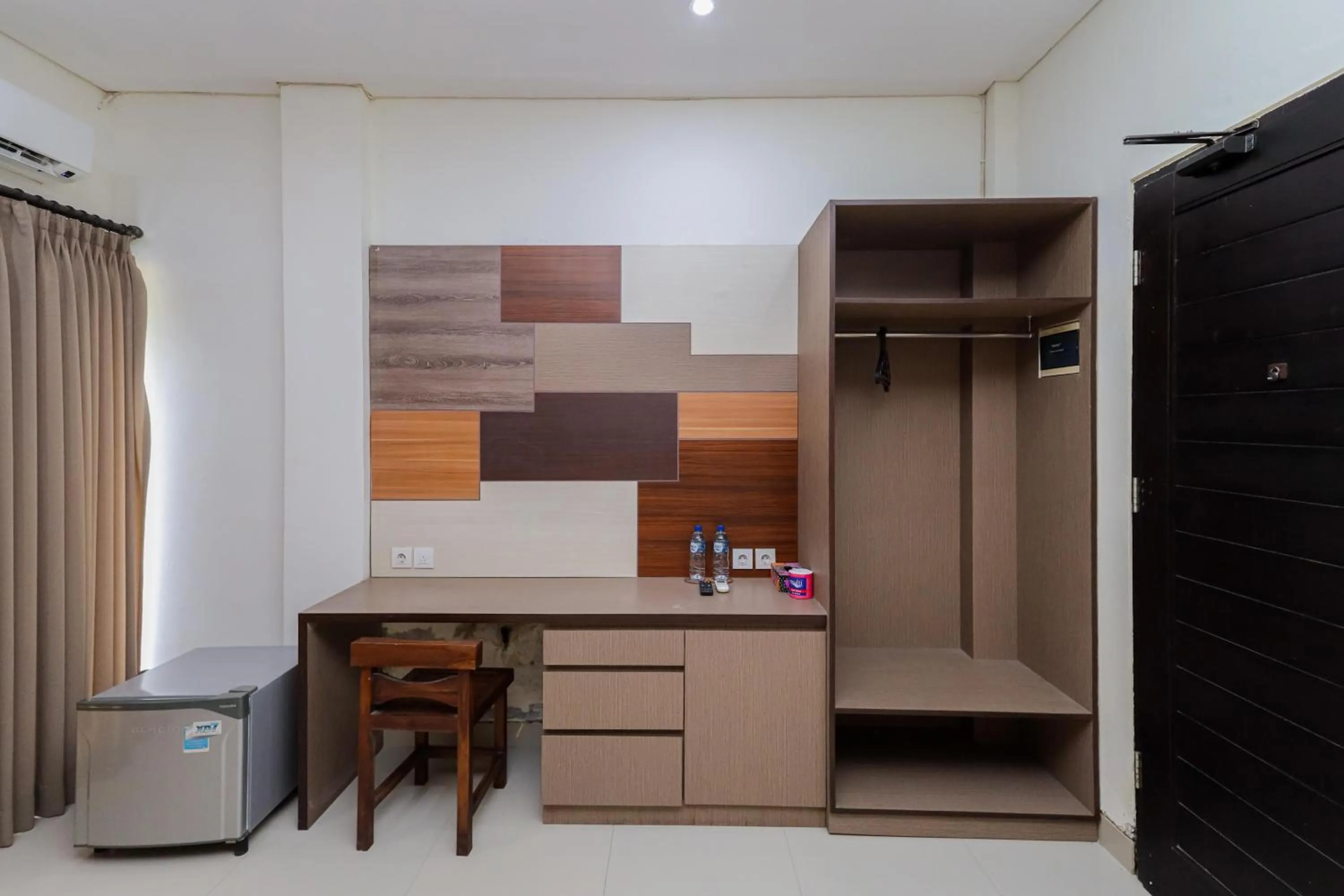 wardrobe in Urbanview Hotel WG Jimbaran Bali
