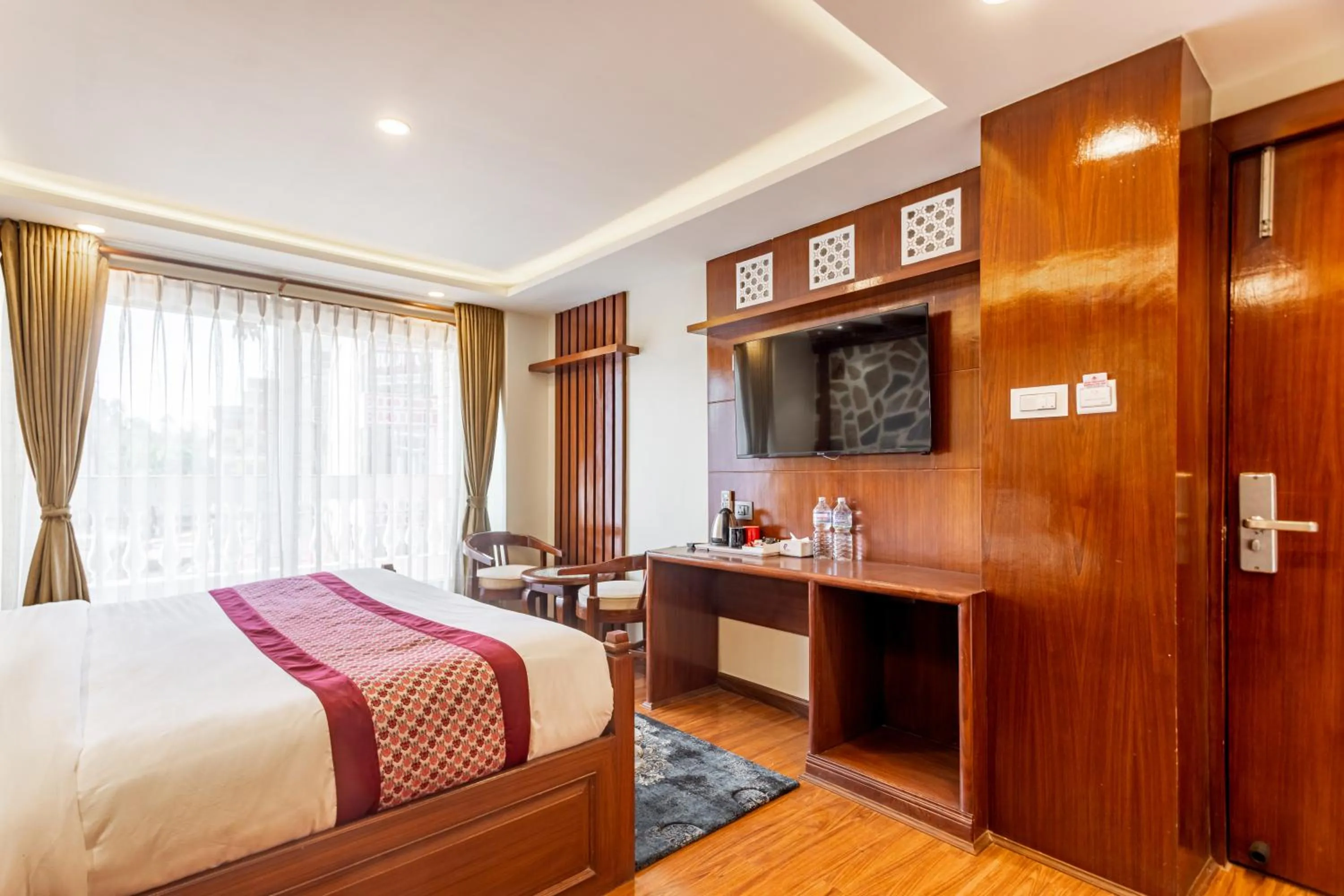 Bed in Amarawati Boutique Hotel